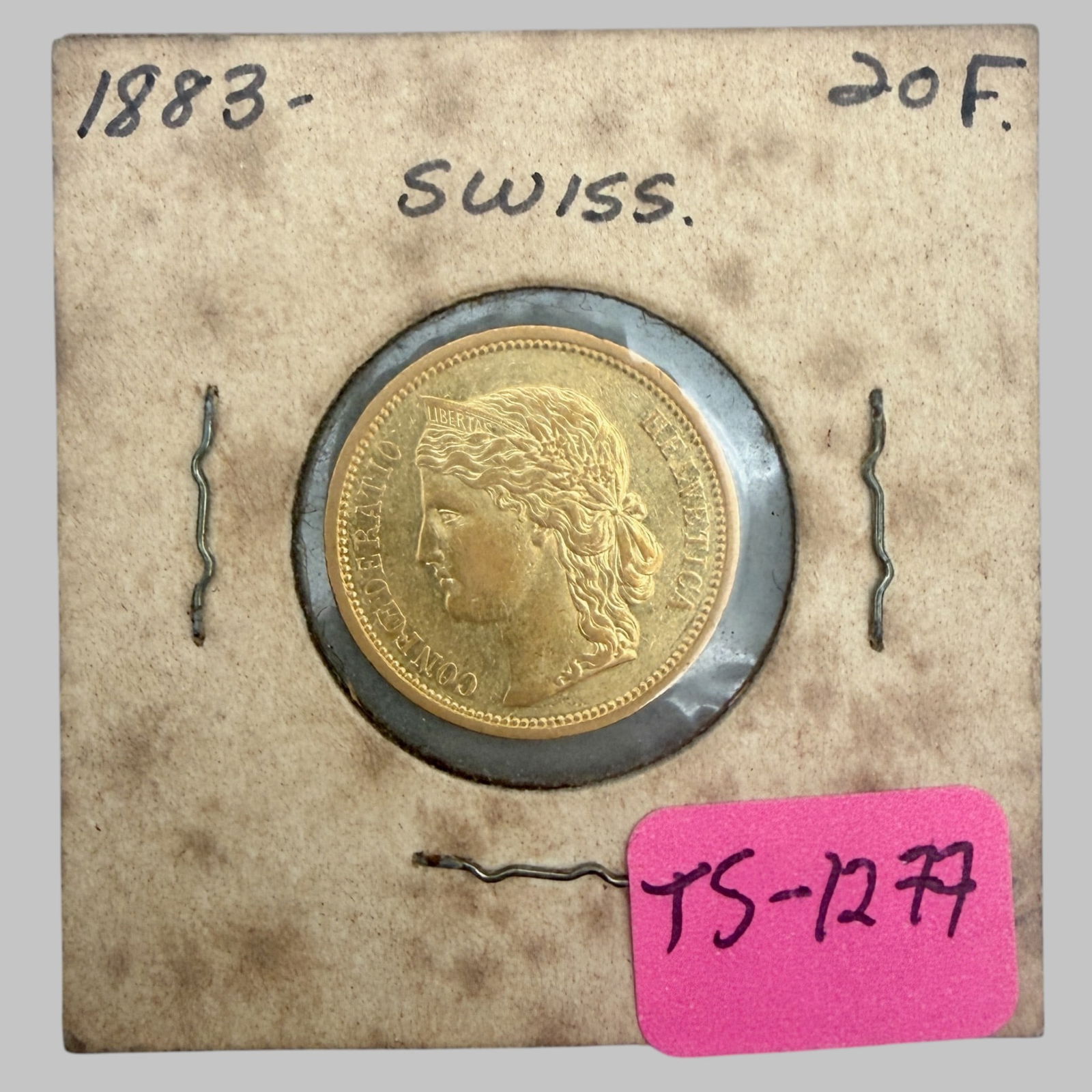 Switzerland Twenty Franc Gold: Dated 1883. Condition Very Good to Fine.