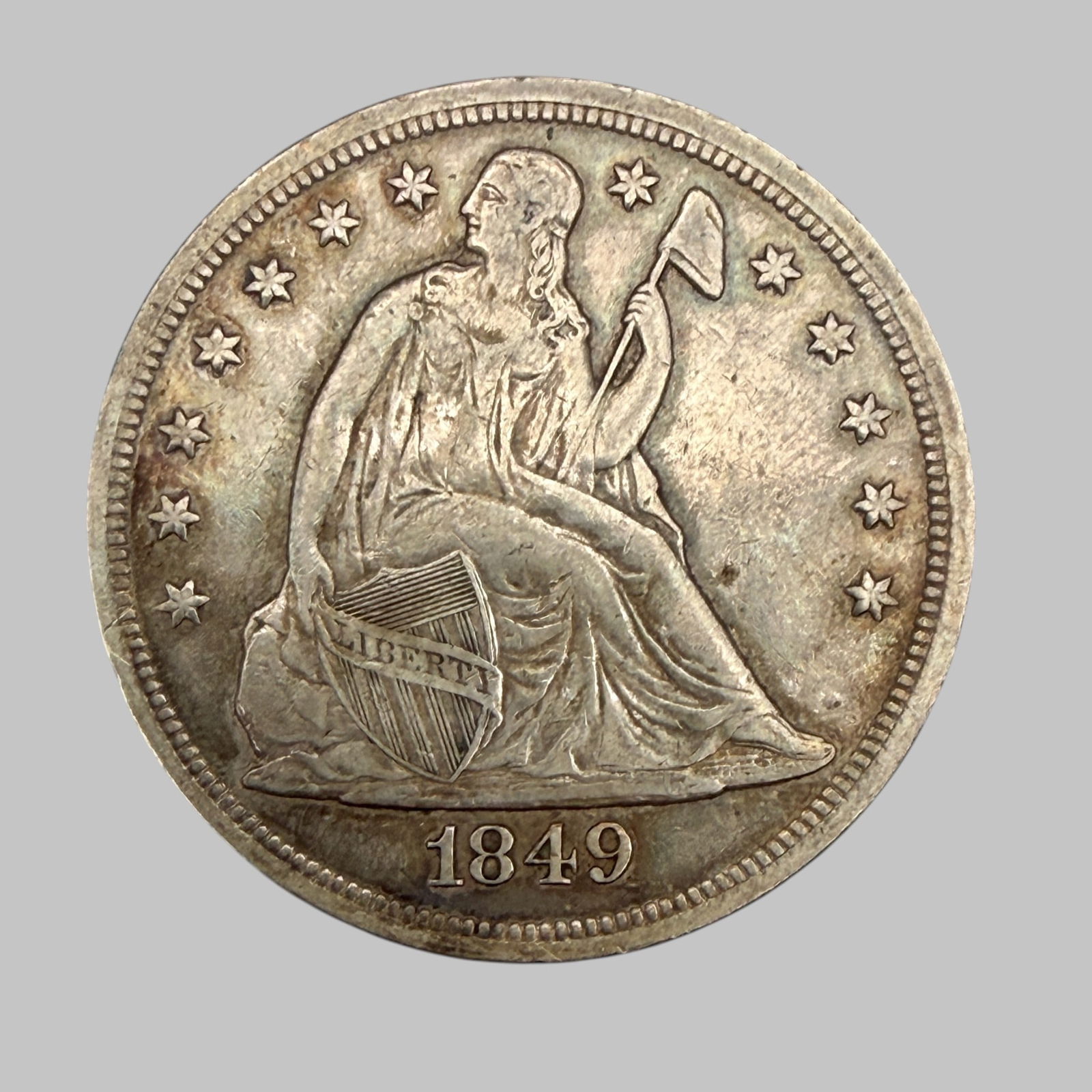 1849 Seated Liberty Silver Dollar: Condition Very Good.