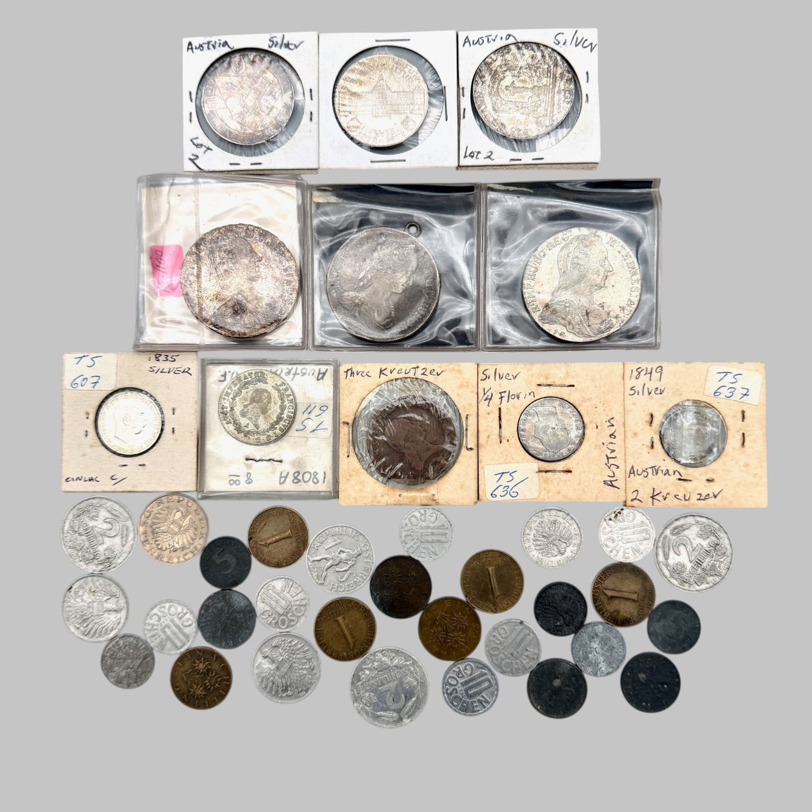Group of Assorted Austrian Coins: Maria Theresia 1780 Silver Trade Thaler (BU); Maria Theresia 1743 Silver Thaler with Madonna & Child reverse, pendant ring added (VG); Another 1780 Silver Trade Thaler (BU); Three Austrian modern