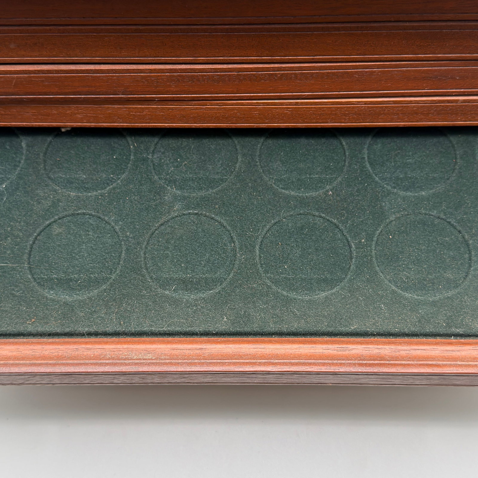 Pair Mahogany Coin Cabinets: Two Chippendale-style mahogany coin cabinets with brass handles and velvet-lined drawers designed for coin storage; smaller cabinet with five drawers and larger with six drawers including literature c
