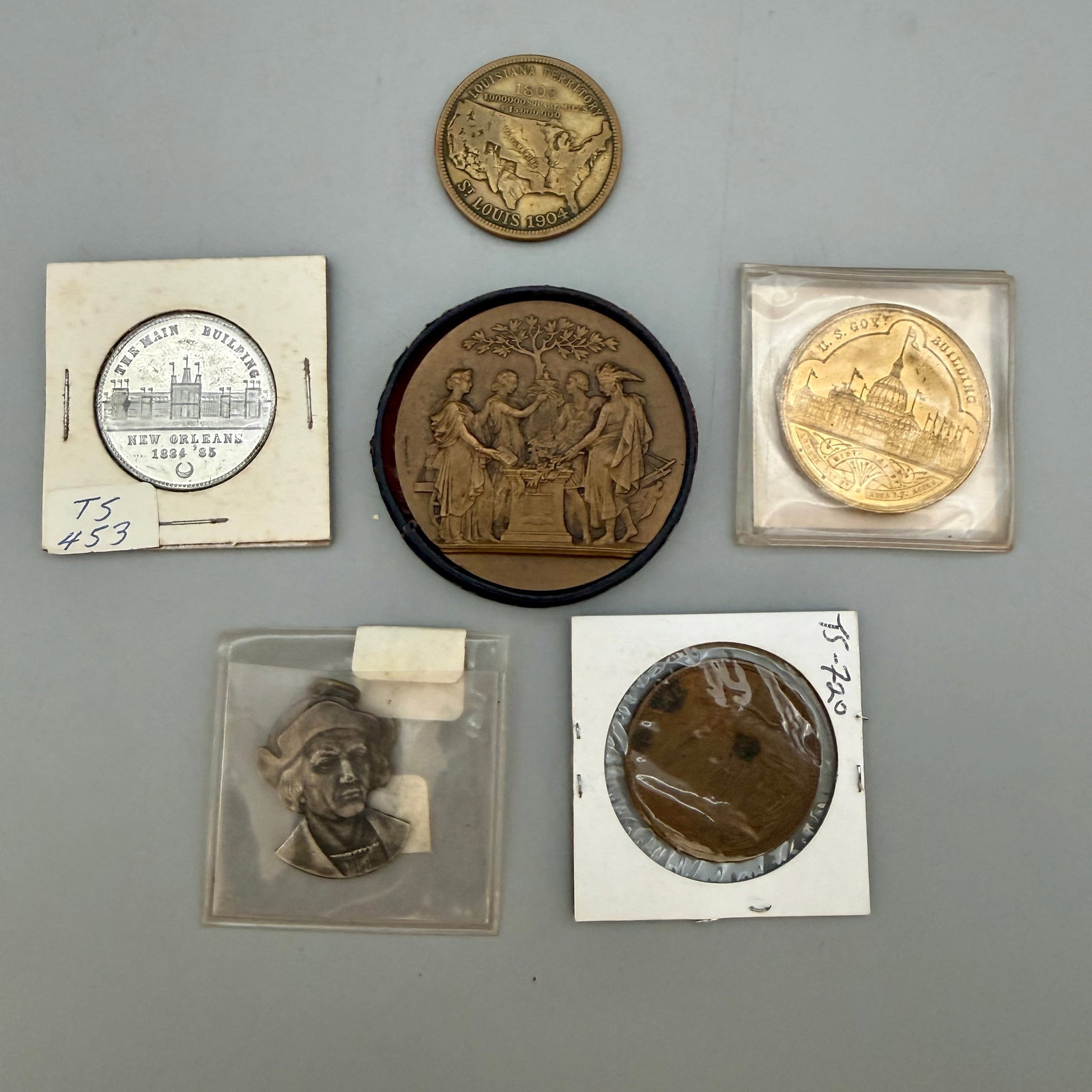 Group of Various City Expo Medals: Six exposition medals: 1904 St. Louis bronze (in box); 1893 U.S. Mint Columbian Expo; Louisiana Purchase Expo medal; 1884 New Orleans Expo aluminum; 1893 Columbian portrait of Columbus; 1910 Cincinnat