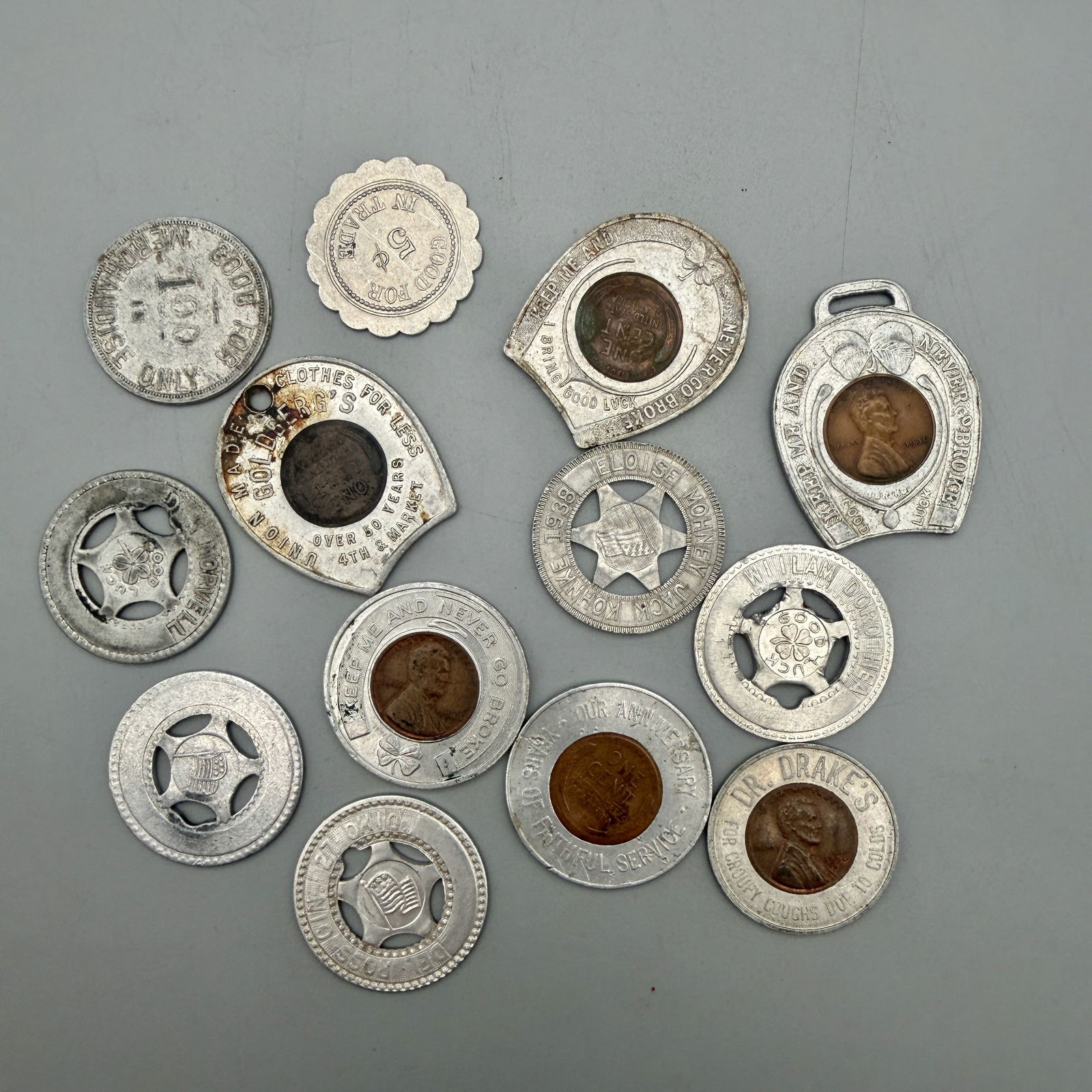 Group of Aluminum Good For & Good Luck Tokens (1 of 3)