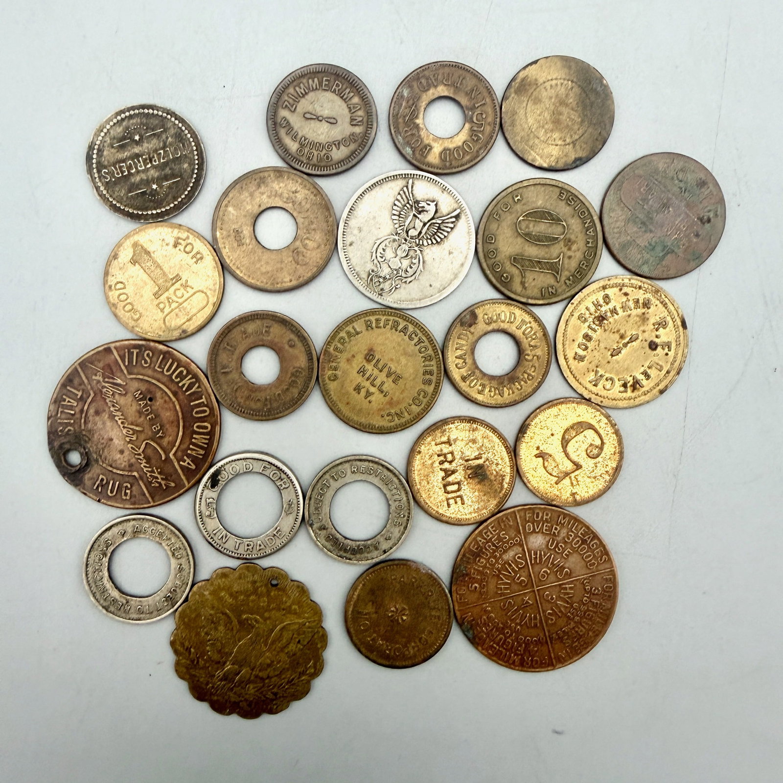 Twenty-Two Good For Merchant Tokens: 22 merchant tokens (mostly early 20th century) including Dayton Confection; United Vending Columbus Ohio; Eckhard; Law Schlenck Oxford Ohio; Zimmerman Wilmington Ohio; Olive Hill KY; R.F. LeVeck New M