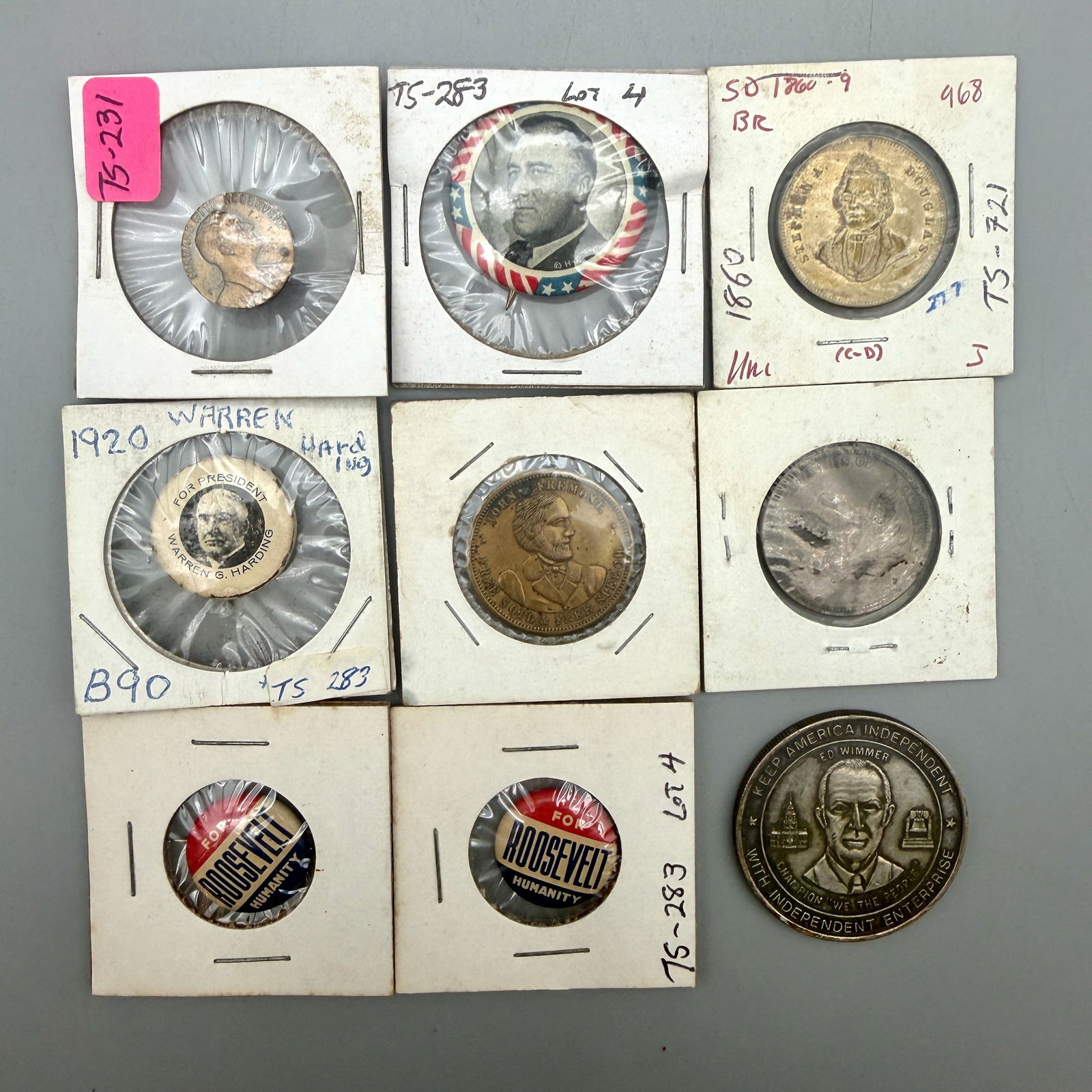 Group of Campaign Tokens, Buttons, and Pins: Includes 1935 FDR Forward With Roosevelt lapel button; Warren G. Harding 1920 pinback; FDR pinbacks; John C. Fremont brass tokens (2); Stephen A. Douglas 1860 token; 1976 American Independent Party Ed