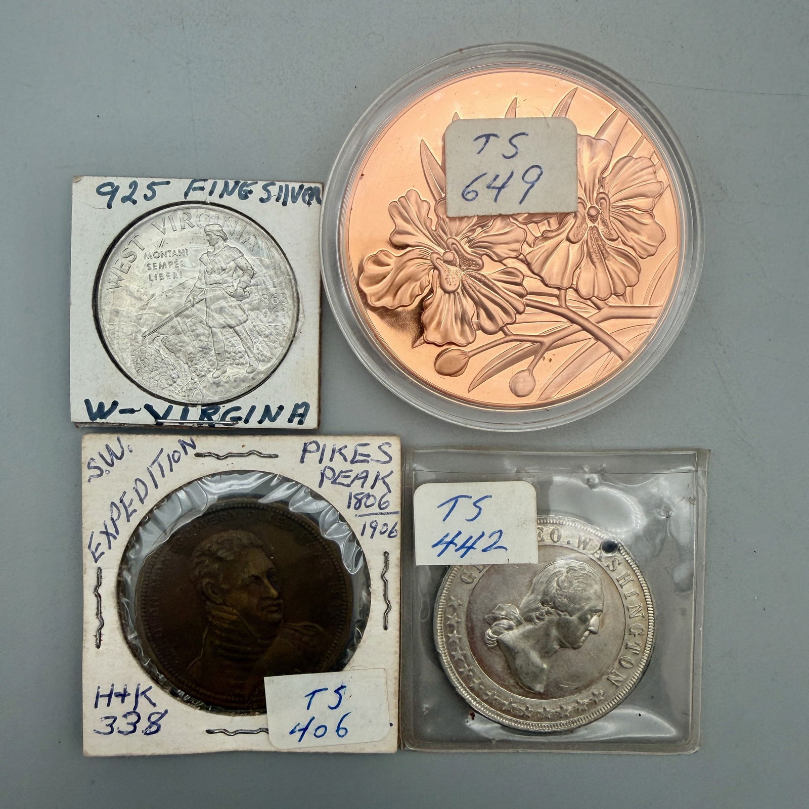 Group of Assorted Commemorative Medals: Includes 1906 Pike’s Peak HK-338; 1893 Washington medal (holed); 1963 West Virginia silver centennial; 1990 Singapore 25th Anniversary bronze. Very Good to Mint.