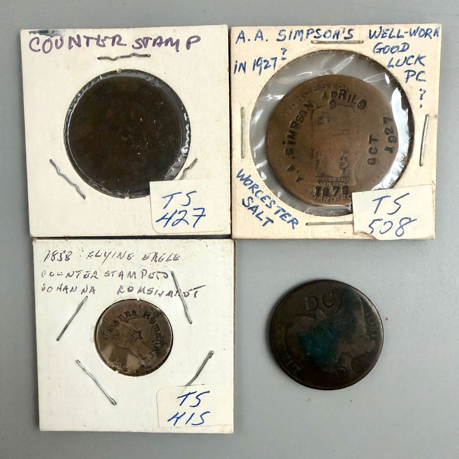 Group of Counter Stamped Cents and Tokens: 1858 Flying Eagle counterstamp; 1801 large cent DC; 1826 D.T. Newton; Worcester Salt token A.A. Simpson. Worn Goodâ Very Good.