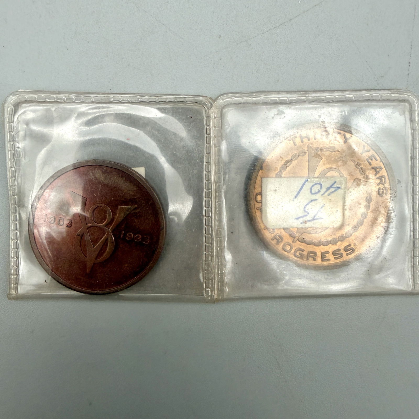 Pair of Ford Motor Company 30-Year Anniversary Medals: Two 1903â 1933 Ford anniversary medals: bronze 34.15mm (Excellent, 97% sheen) and bronze-plated white metal 31.05mm (Very Good).