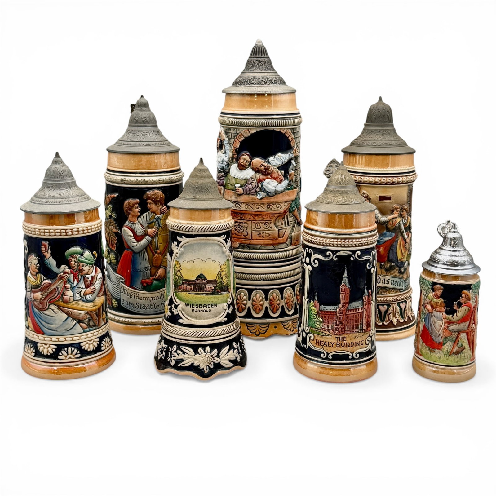 Group of 7 German Steins: All with scenes of revelry, music and dancing. Some with florals. All of German origin. Tallest height: 13.25"