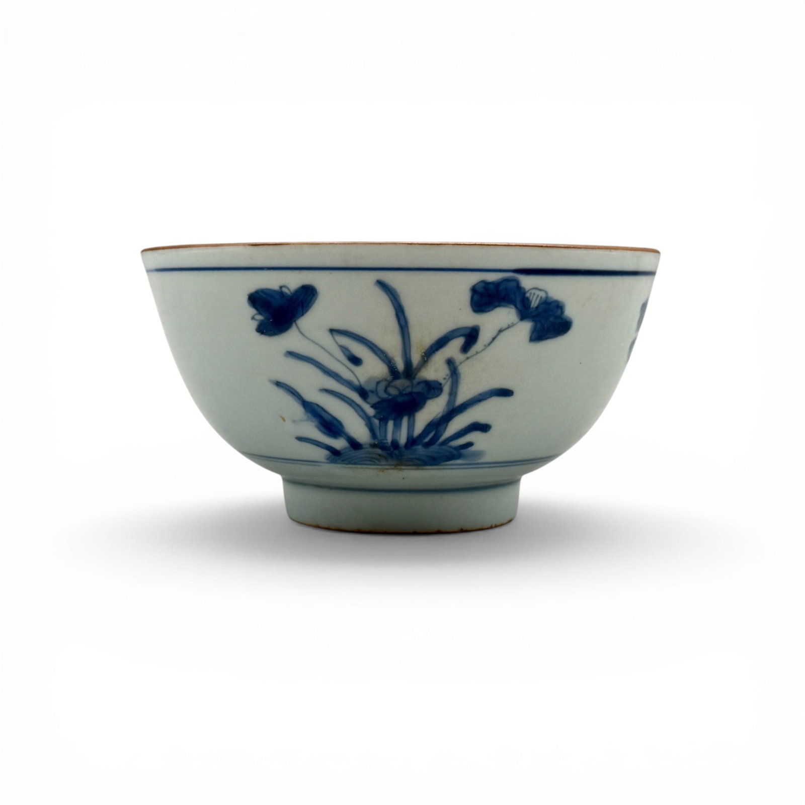 Qing Dynasty Bowl, Qianlong Mark: A blue and white bowl with copper toned rim, the underside with apocryphal Qianlong six character underglaze mark inside double ring. Ht. 3", diameter 5.25".