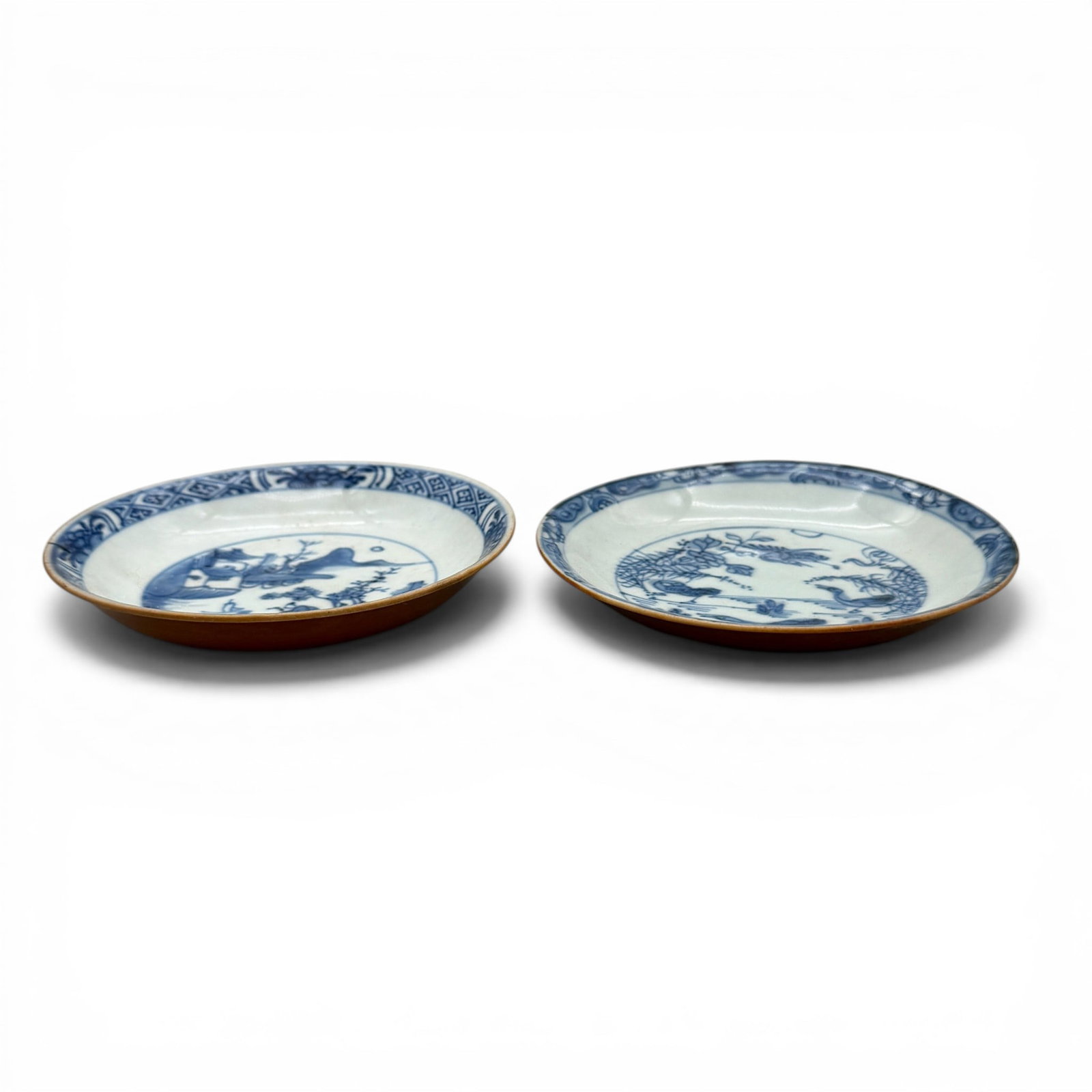 Pair of Chinese Dishes: 19th century, a pair of blue underglaze decorated interiors, and copper undersides. Each diameter 4.5".