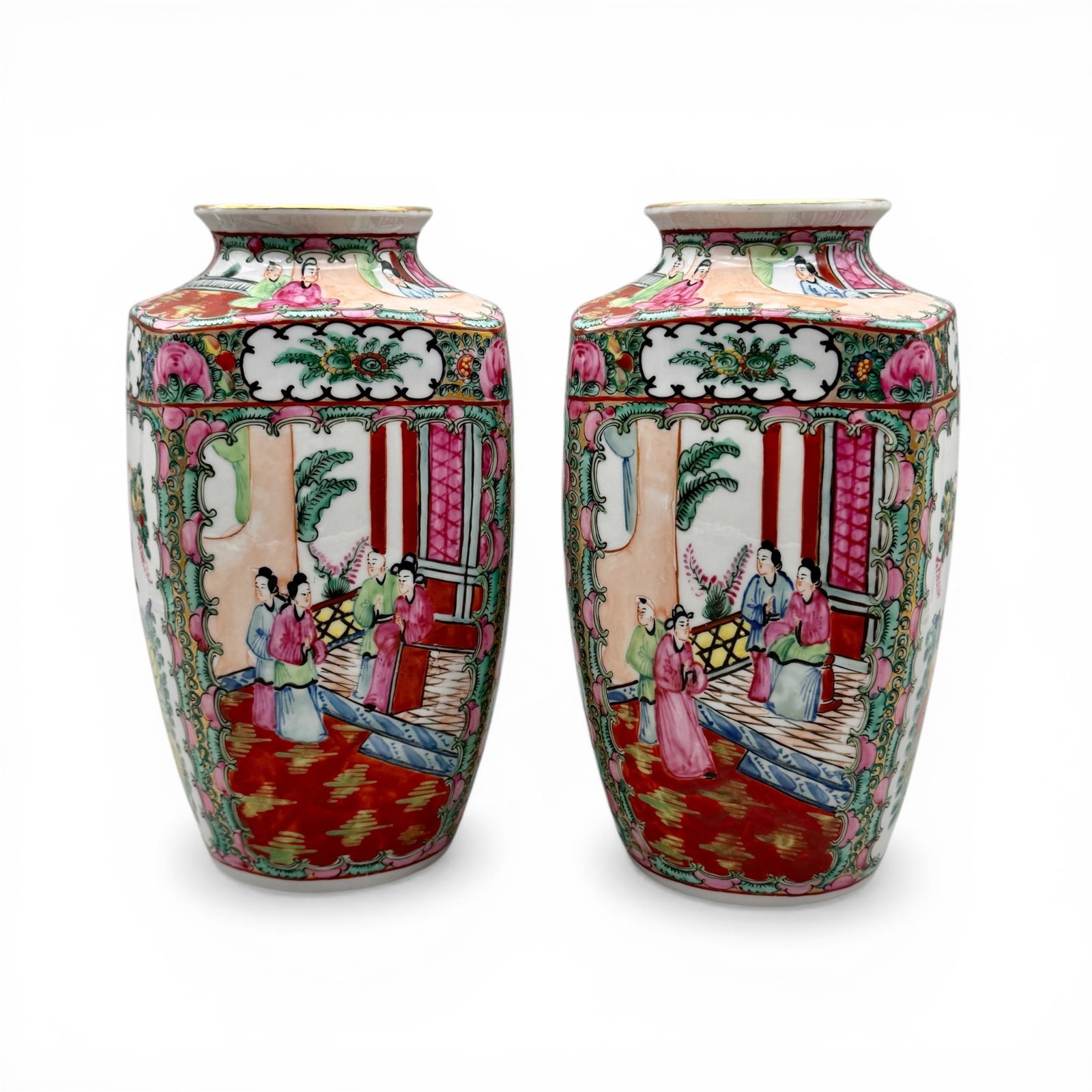 Pair of Chinese Famille Rose Vases: Canton style export ware, featuring interior scenes and decorated in the round. Gilt rim. Unmarked. Height: 9.5" each