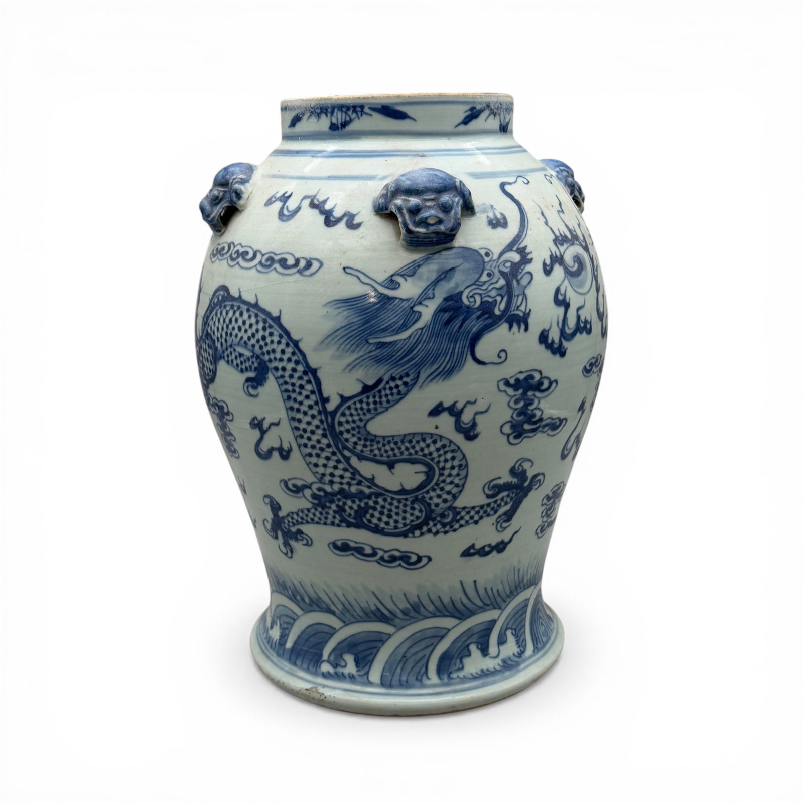 Ming-style Blue and White Underglaze Decorated Vase: Unmarked to base, likely 19th century. Featuring design in underglaze blue of dragon chasing the flaming pearl. Height: 14.5"