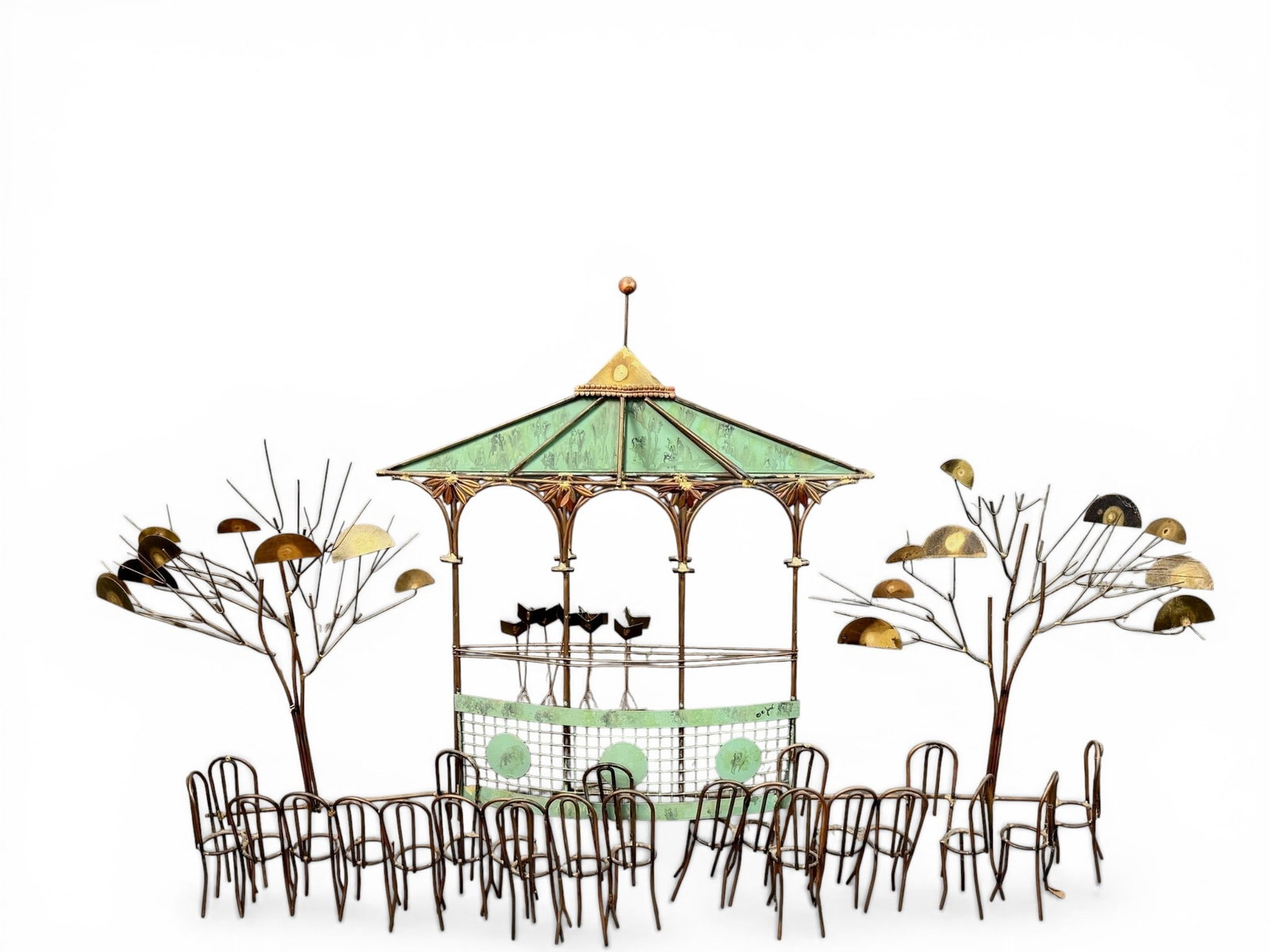 Curtis Jere Musical Themed Wall Sculpture: Numerous seats sit in front of a stage with music stands and trees flanking. Signed C. Jere. height: 27.5", length: 43.5"