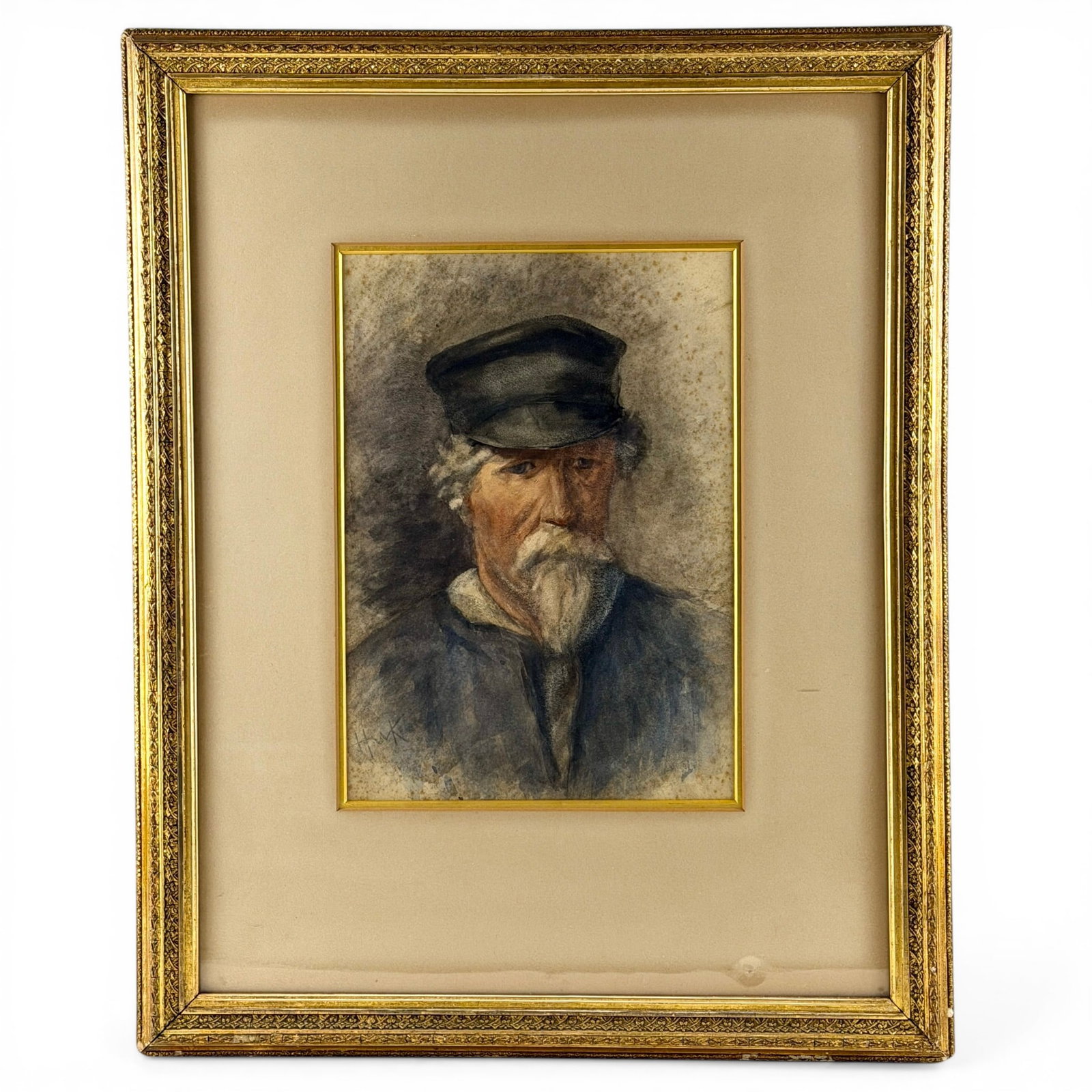 Portrait by Henry William Kirkwood: Henry William Kirkwood (New Zealand, 1854-1925). Watercolor on paper, depicting a gentleman with a cap, initialed l.l. Housed in gilt and gesso frame.