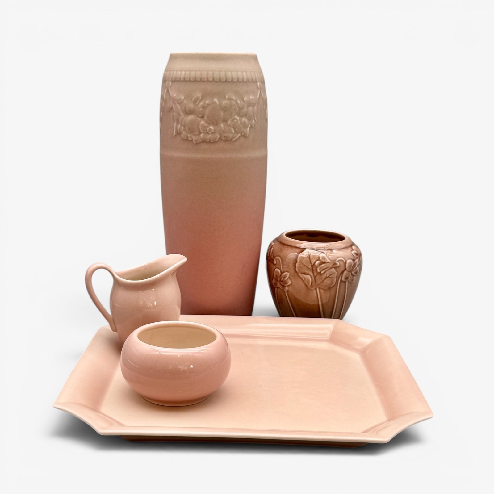 Group of 5 Rookwood production items: Group of 5 Rookwood porduction items. 1. Tall vase with bane of flowers, drilled, circa 1925. 2 & 3. Creamer and sugar, 1954, shape 547. 4. Vase with embossed flowers, 1948, Shape 6432. 5. Tray,