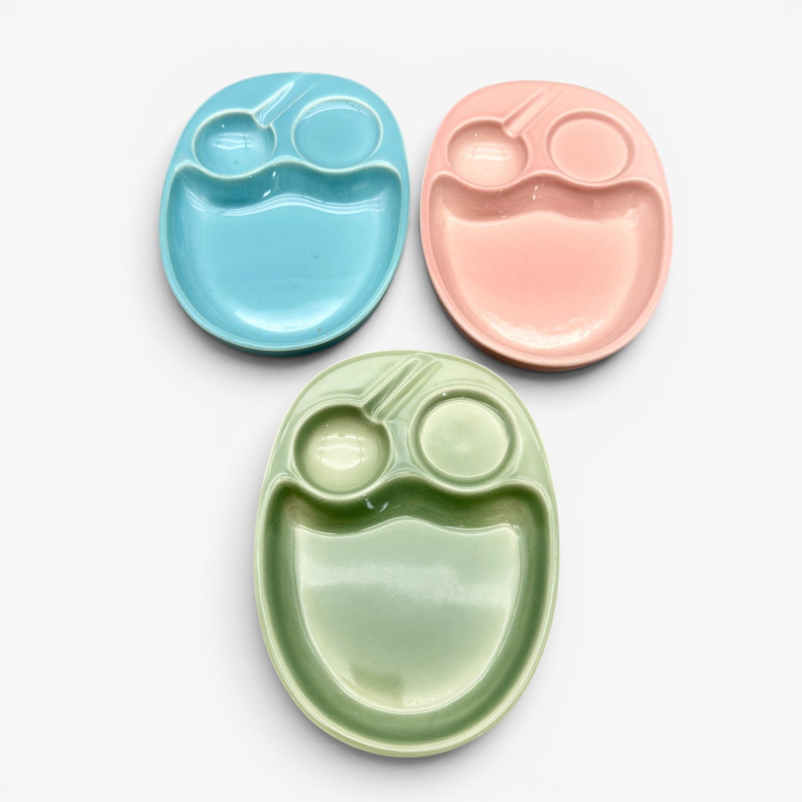 Three Rooiwood trays, pink, blue, green.: Three Rookwood trays, one pink, one blue, one green. All dated 1951, Shape number 7081. Height 7/8 inch, length 7 1/8 inches.