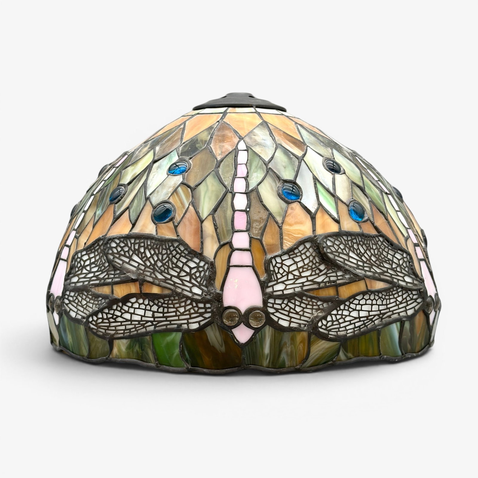 Modern Tiffany style Dragonfly art glass shade.: Modern day Tiffany style dragonfly leaded glass shade including perforated wings and glass eyes. Not siged. Height with heart cap is 9 1/2 inches. Diameter at base is 14 inches.
