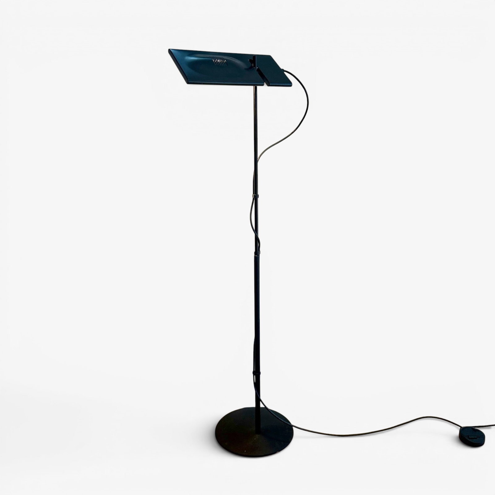 Italian Luce Duna Floor Lamp: Black Patinated Metal Adjustable Floor Lamp, designed by Mario Barbaglia and Marco Colombo, with rectangular articulated light and cylindrical stand on circular base, marked to the underside. 71.75"