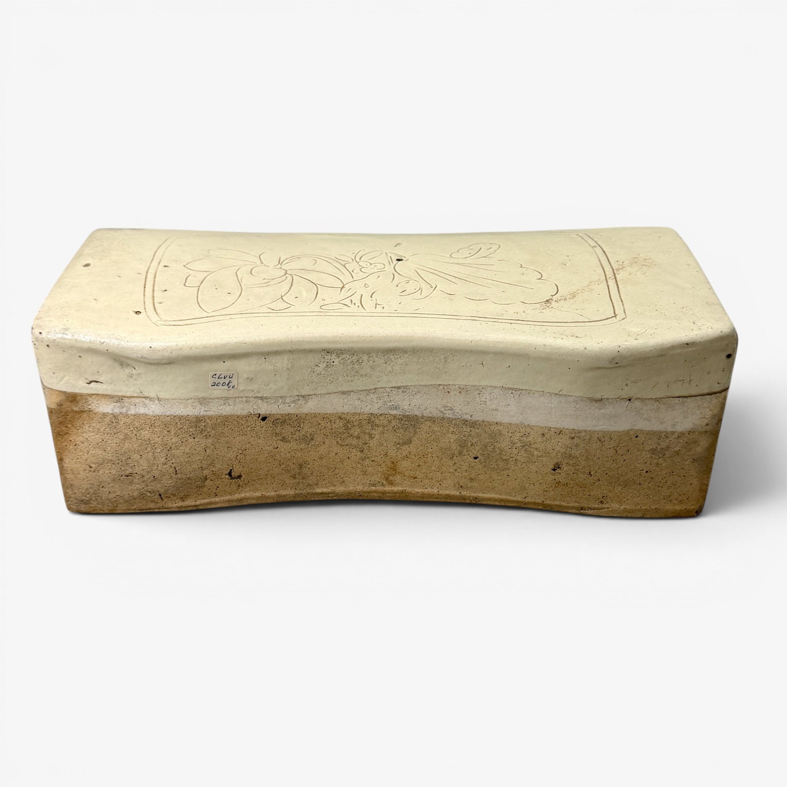 Cizou Type Ceramic "Pillow", Song: Song Dynasty, a Cizou type pillow, bowed and with floral decoration to cover. Lg. 12.5".