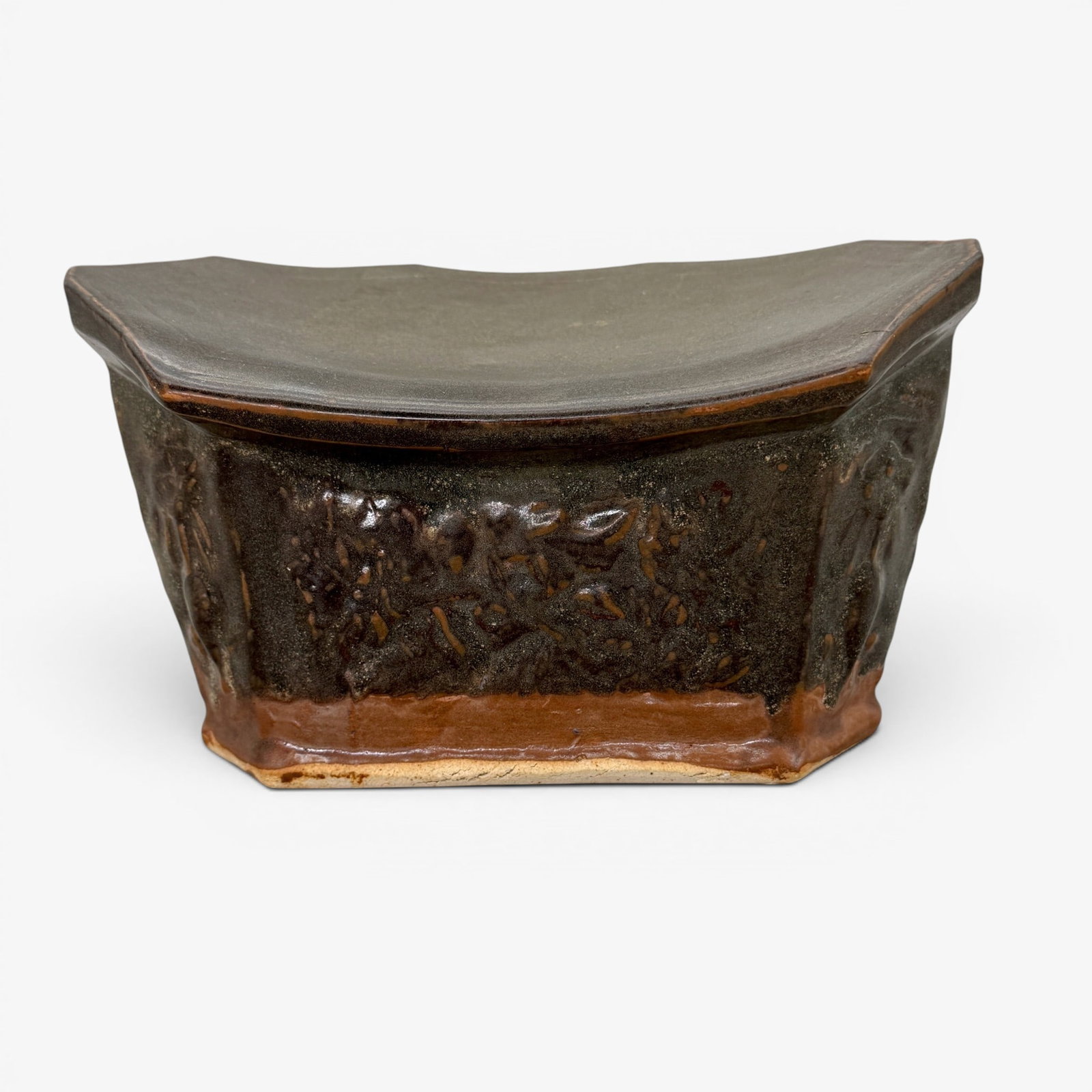 Song/Jin Glazed Pottery Pillow: Song/Jin Dynasty, sloped cover, panels in lower portion with foliage. Ht. 5", lg. 9.5".