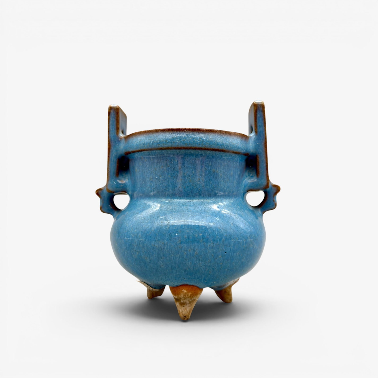 Song/Yuan Sky Blue Jun Ware Censer: Song/Yuan dynasty. A sky blue glazed tripod censer. Ht. 4.5". PROVENANCE Private Collection, Columbus OH Collected from sources in Southeast and East Asia, ca. 1965-1975, and subsequently in New