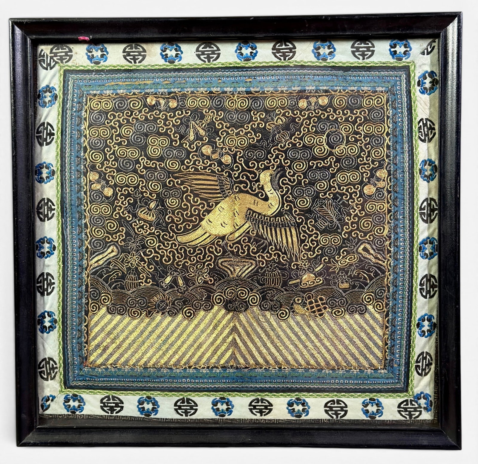 Chinese Rank Badge, Golden Pheasant: A rank badge in gold silk threading for the pheasant, bordered by auspicious symbols. Framed, 16" x 16".