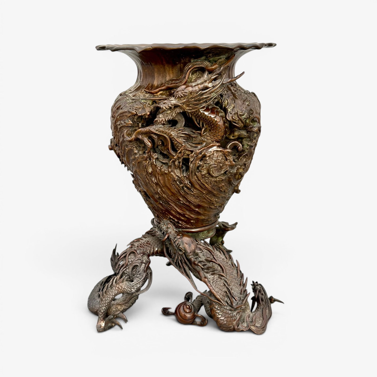 Japanese bronze two piece "Dragon" censor: Amazing Japanese two part urn. The upper part features a dragon visually appearing to weave in and out of the urn itself with areas that at first appear reticulated. This part vears a three character