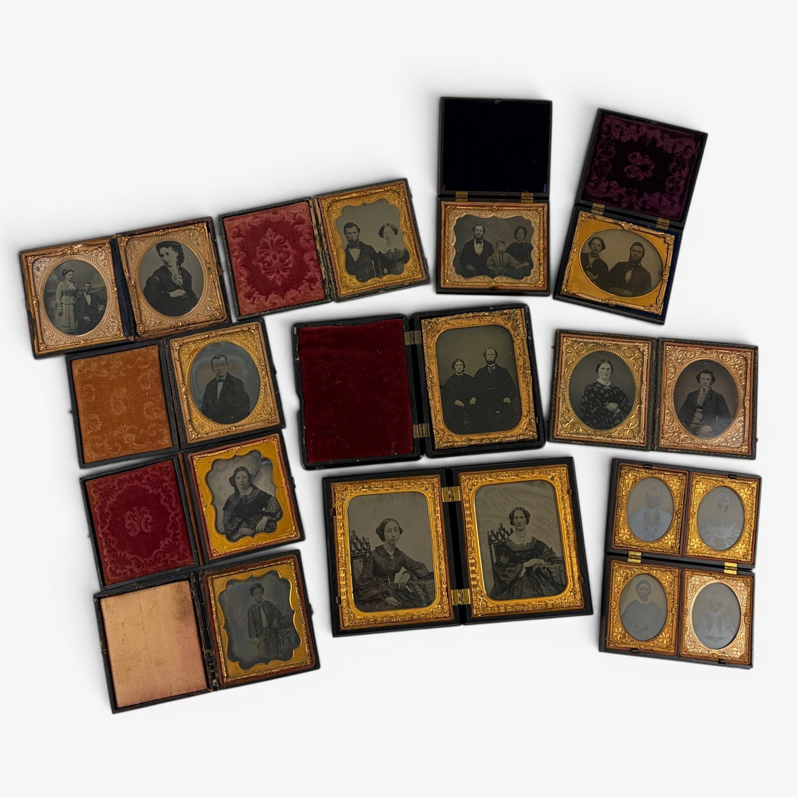 Large Collection of Cased Images: Mostly tintypes, including double-cased and one quadruple-cased image, all depicting single individuals or families. 17 in total.