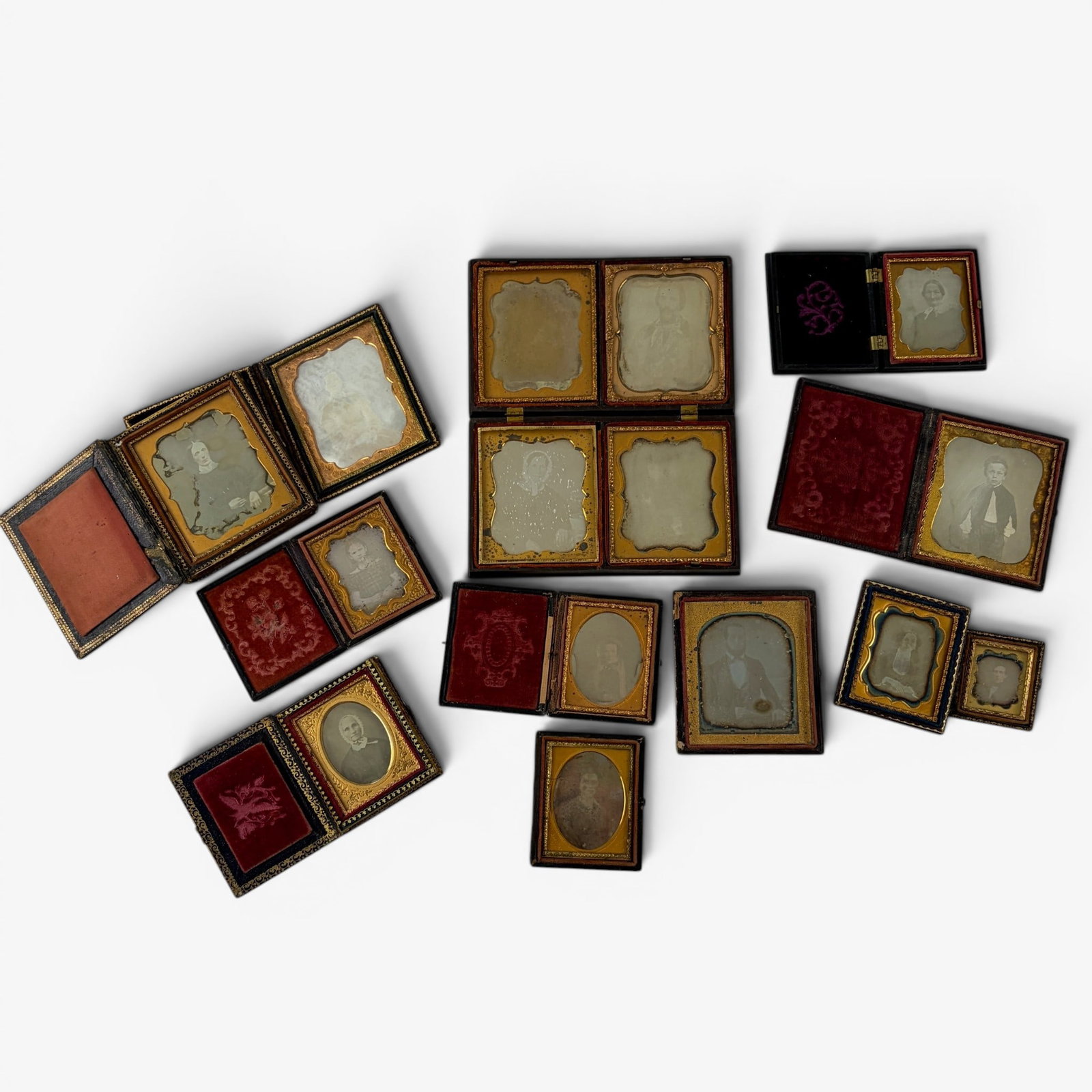 Collection of 14 Dageurreotypes: All encased with some damage or missing elements to the cases themselves. 14 in total, mostly depicting family members and unknown individuals/family portraits.