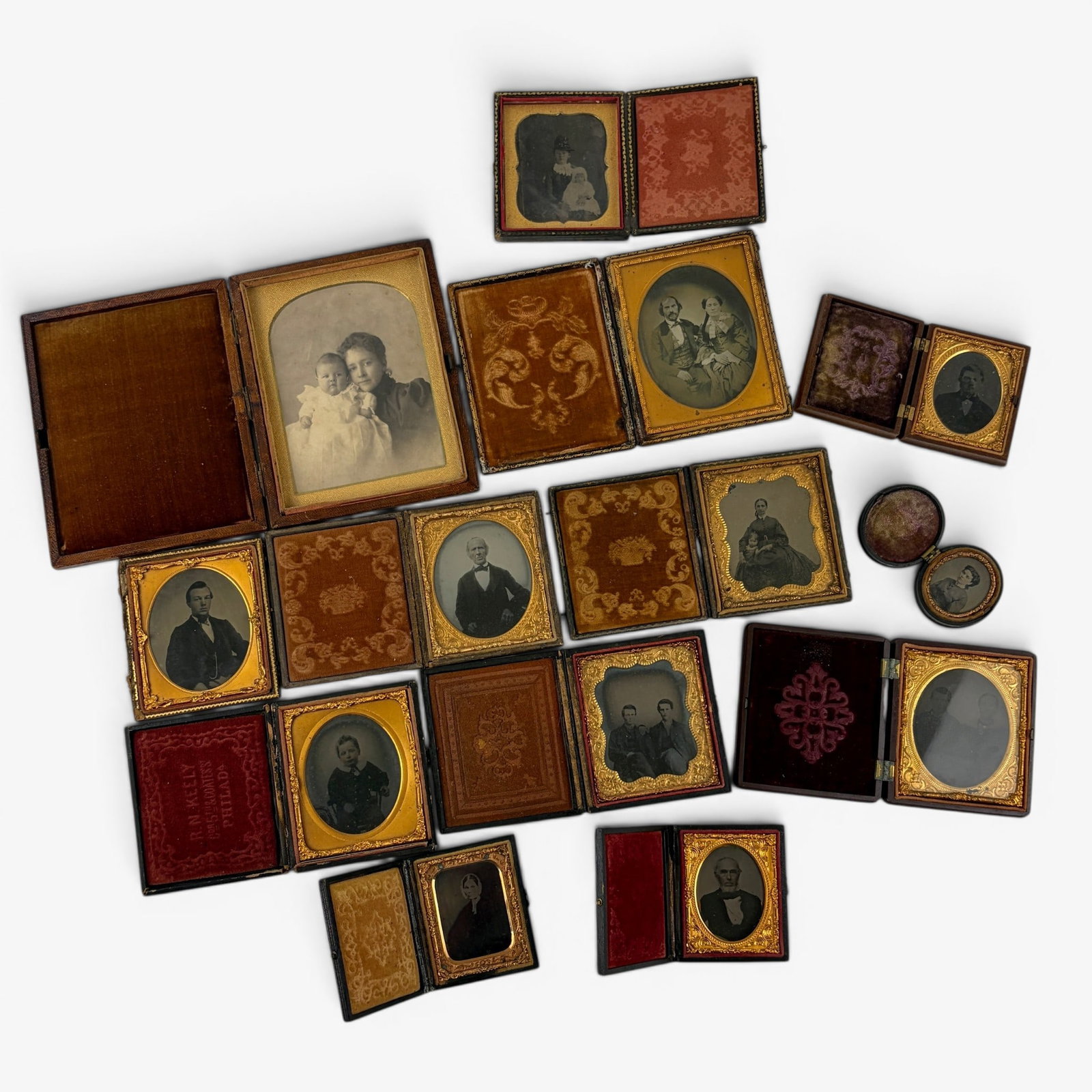 Group of 13 Cased images: Featuring mostly tintypes with other examples included of families (mostly seated). One CDV of a woman and child. Some wear to cases or missing hinges.