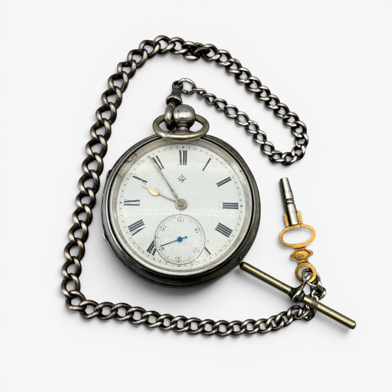 Antique Sterling Silver Pocket Watch: Marked indistinctly inside the case back, likely an English manufacturer.