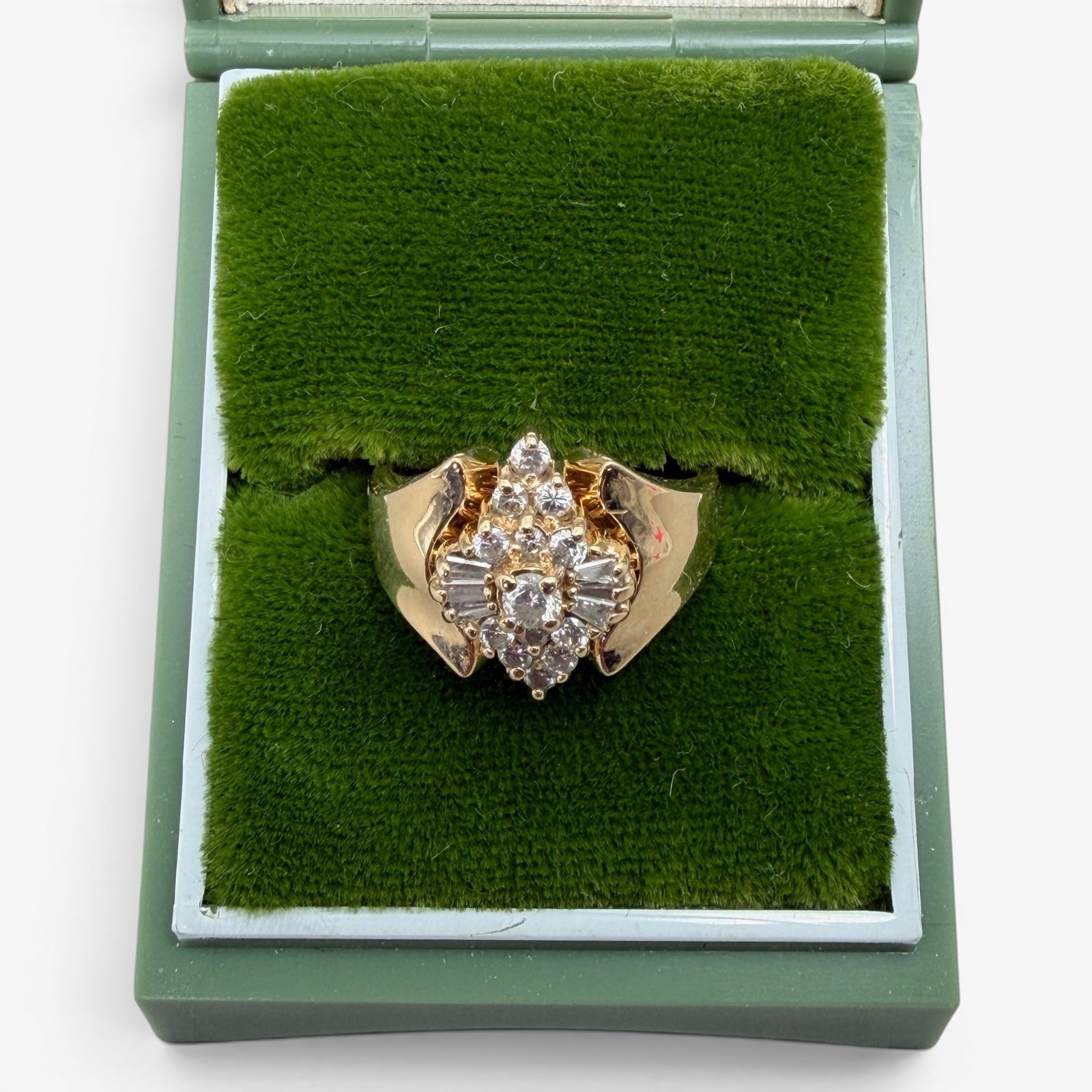 Lady's 14K Gold and Diamond Ring: Including 13 round cut full diamonds and 6 baguette diamonds with approx. .50 ctw. Accompanied by an appraisal from Klass jewelers. Please review the formal appraisal for details on the diamond