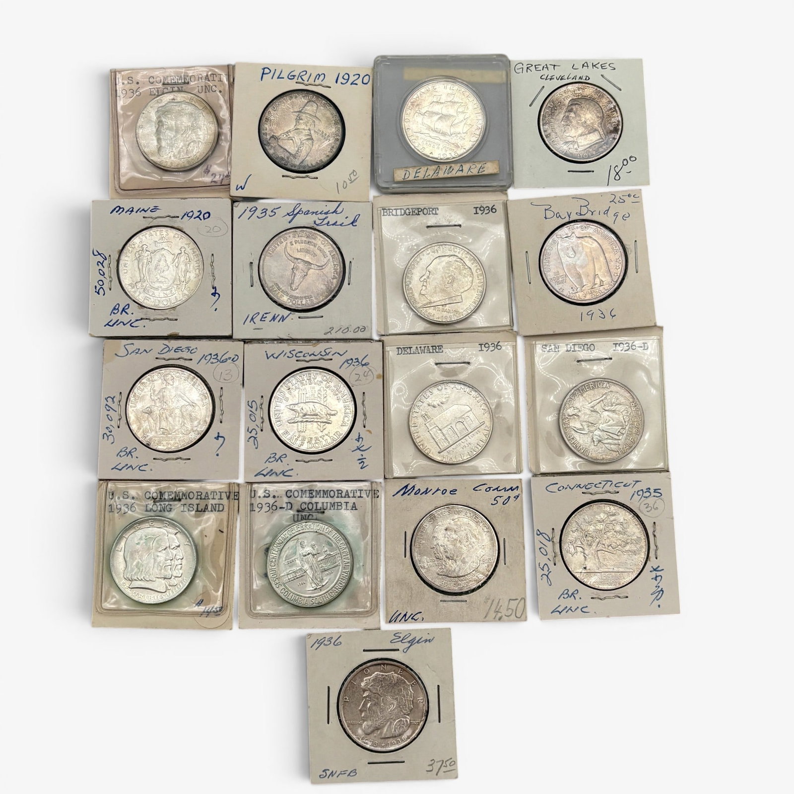 17 Early American Commemorative Coins: Struck in silver. Coins vary from presidential and statehood pieces to the Spanish trail and pilgrim half dollars. A nice grouping housed in collectors sleeves, stapled.