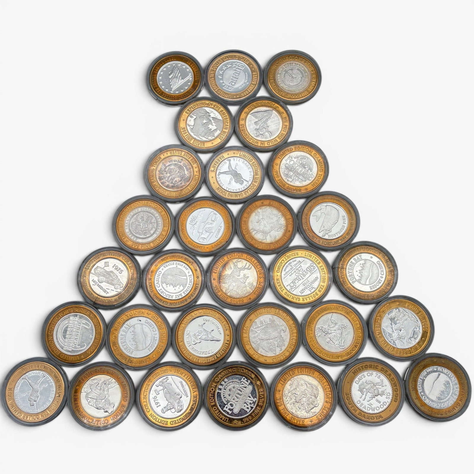 30 Silver Gaming Tokens, Each .999: Each token incliudes .6 ozt of .999 Silver for a total of 18 ozt. From varying casinos and excursions.