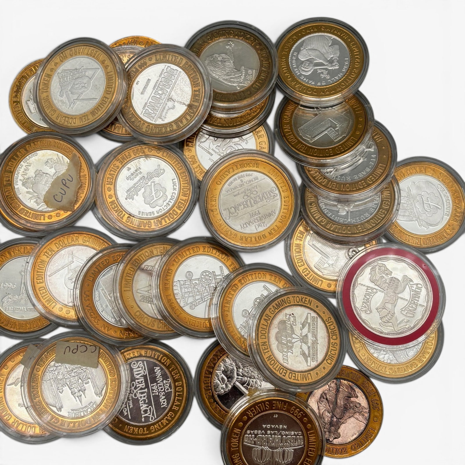 33 Silver Gaming Tokens, Plus One Other Coin, all .999: Each token incliudes .6 ozt of .999 Silver, and an addition commemorative coin for a total of 20.8 ozt. From varying casinos and excursions.