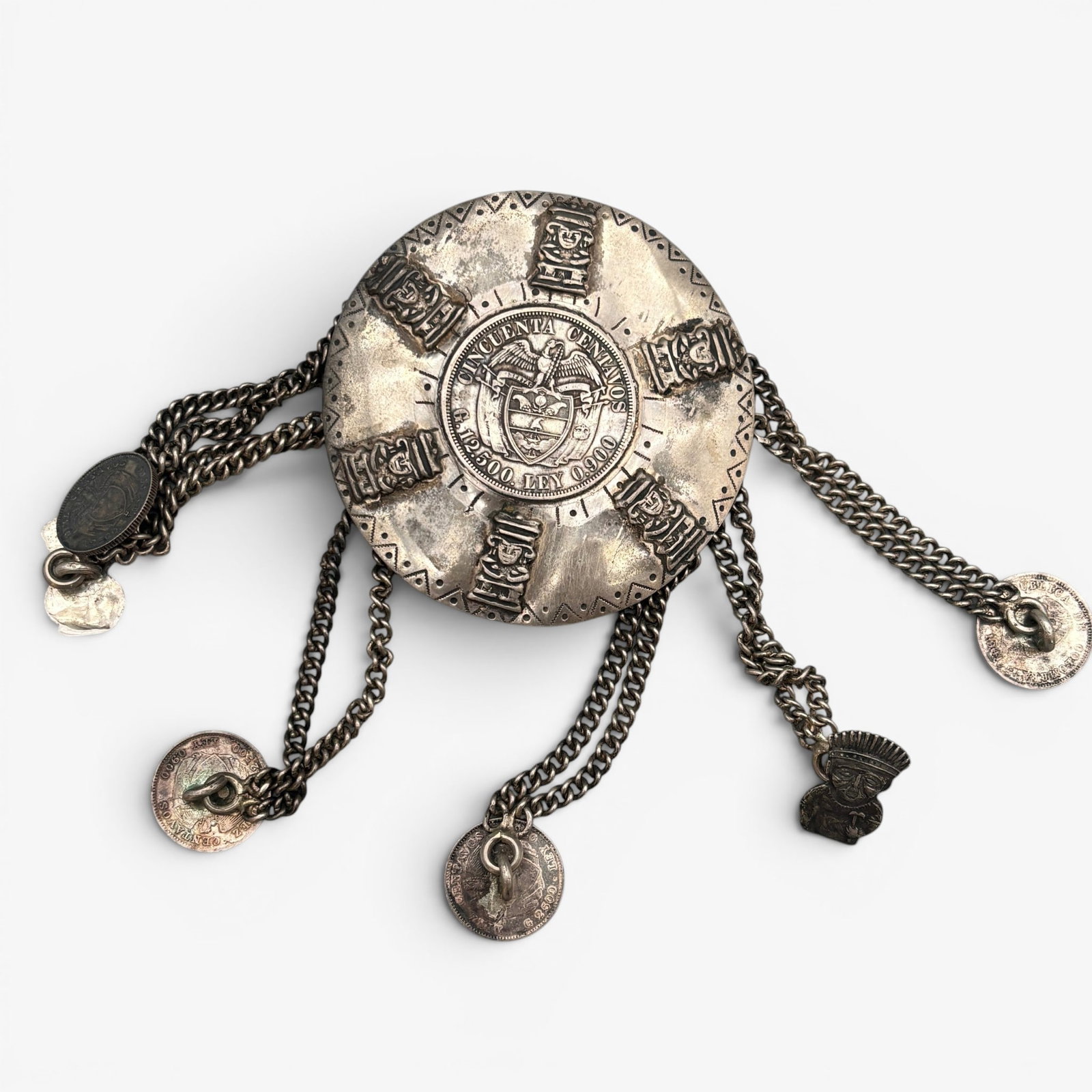 Colombian Coin and 900 Silver Jewelry Piece: An unusual piece of jewelry made from Colombian coins and miniature figures. Wrapped in 900 silver and marked for 900 silver to back. Total weight: 2.59 troy ounces