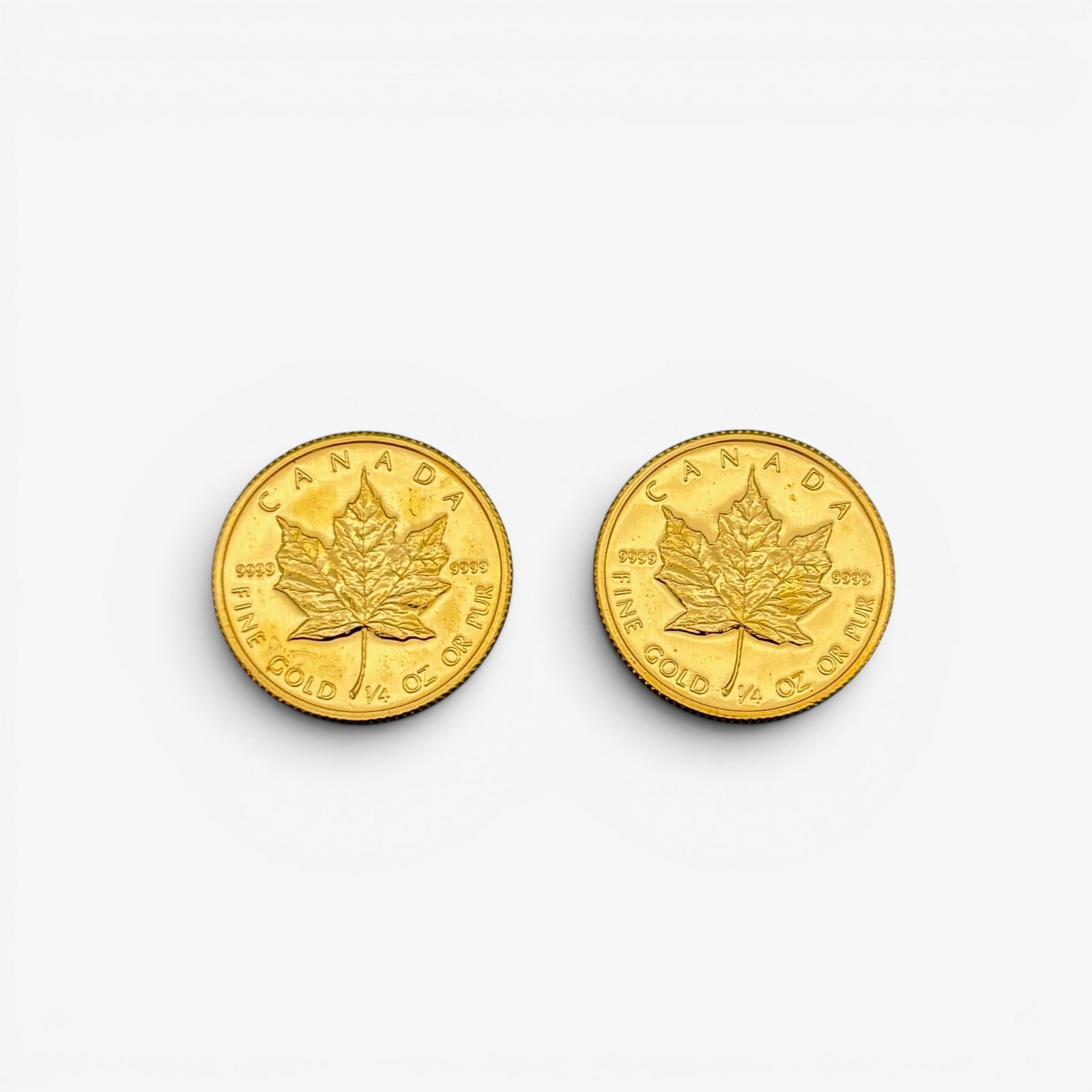 Pair of 1/4 Ounce Fine Gold Maple Leafs (1 of 1)