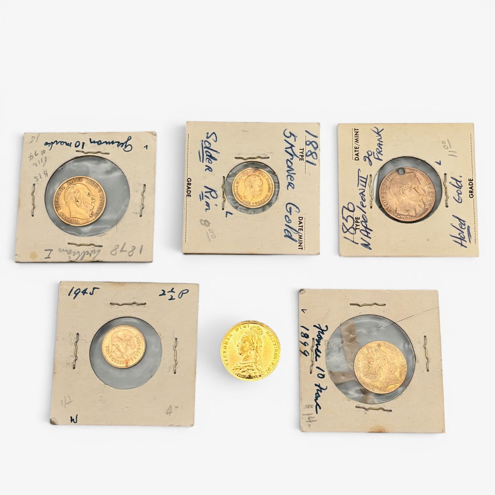 Group of European Gold Coins: Including an 1889 Gold Soveriegn Jubilee Head British coin, an 1856 Napoleon III 20 Francs coin, an 1899 10 Franc coin, a 1945 2 1/2 pesos gold coin, a German 1878 10 marks coin and finally an 1881 Fi
