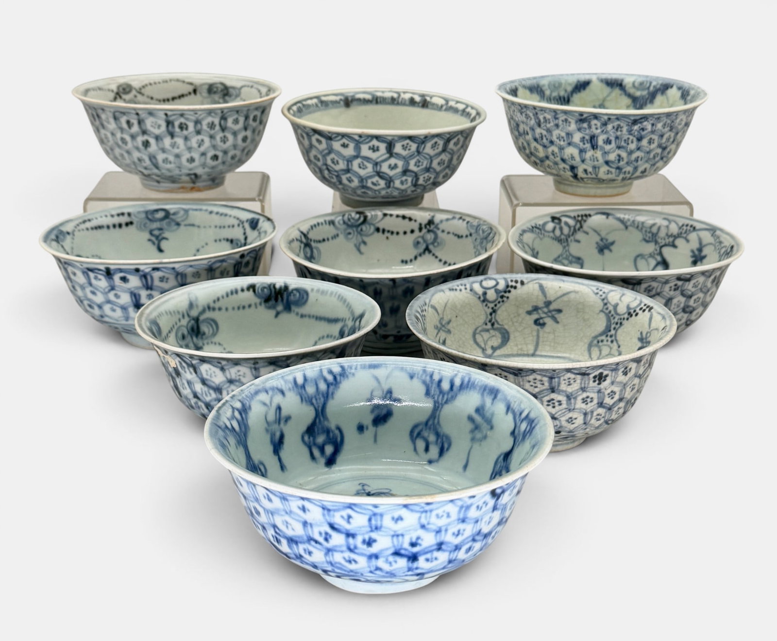 Collection of Diaper Pattern Ming Bowls: Each Ming dynasty, a total of 9, all in blue underglaze diaper lace pattern to exteriors. Each approximately 2.75" ht., 6" diameter.