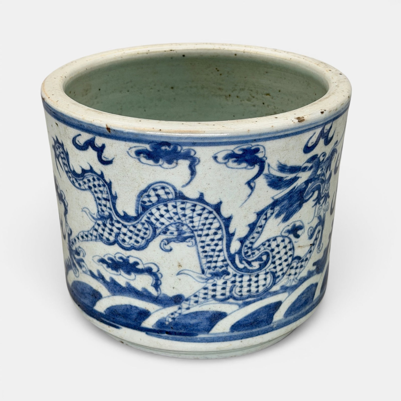Ming Blue and White Dragon Planter: Ming dynasty, a planter with dragon and flaming pearl design, the underside burned to an even dark brown. Ht. 7".