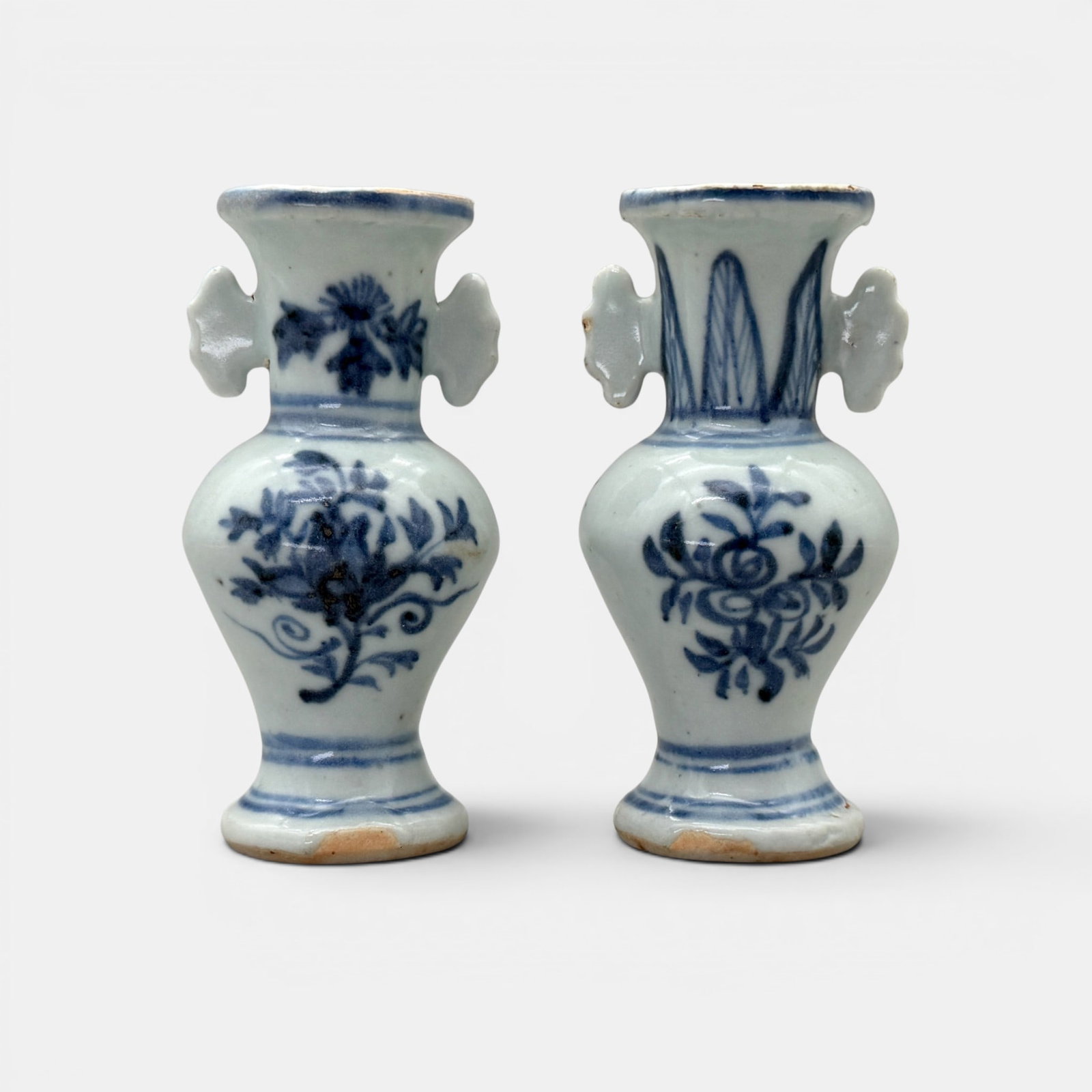 Pair of Ming Period Blue and White Vases: Each with two handles, each with flower and leaf design and double rings at foot. Height of each: 4"