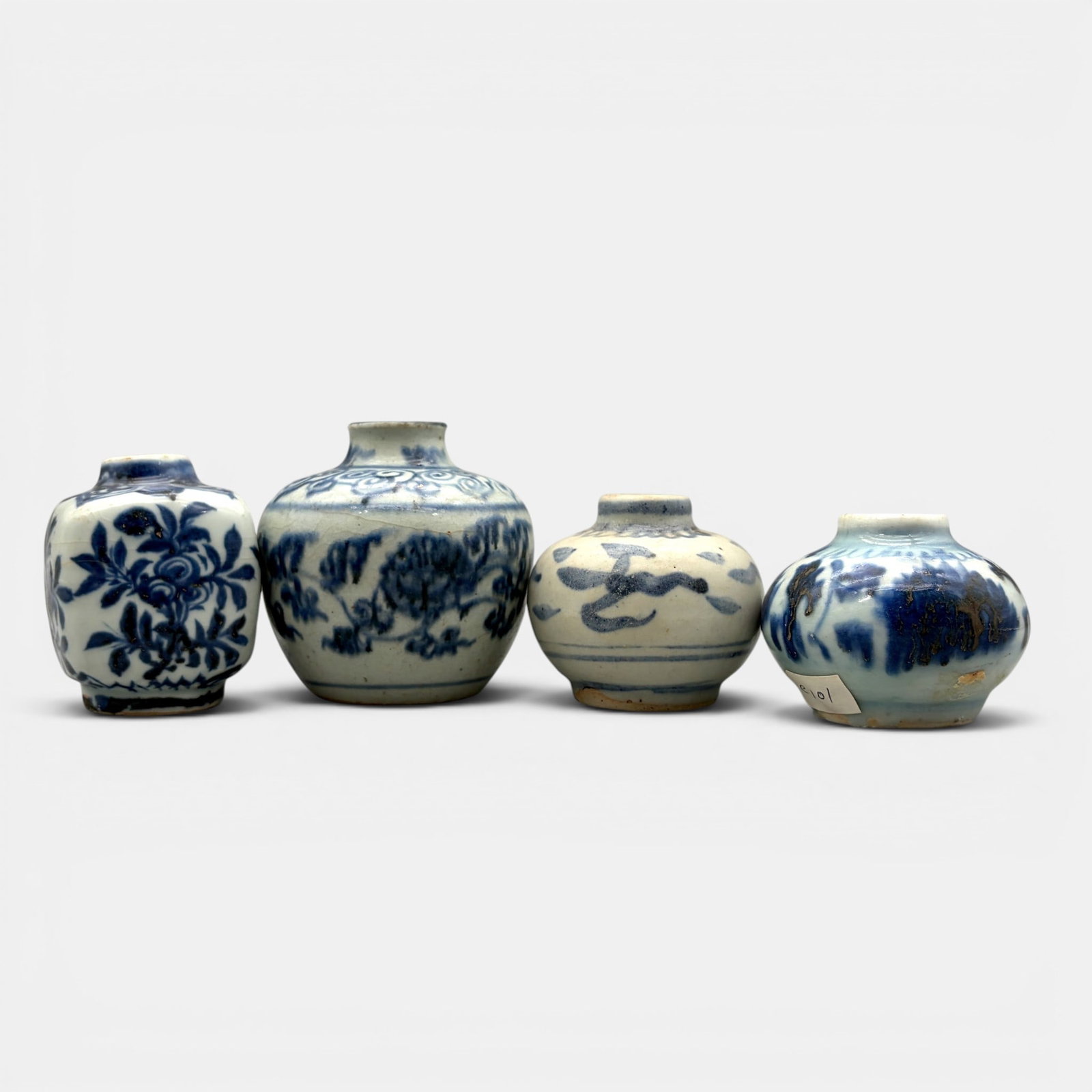 Four Ming Blue and White Jars: Including one square form jar. Tallest height: 3.25"