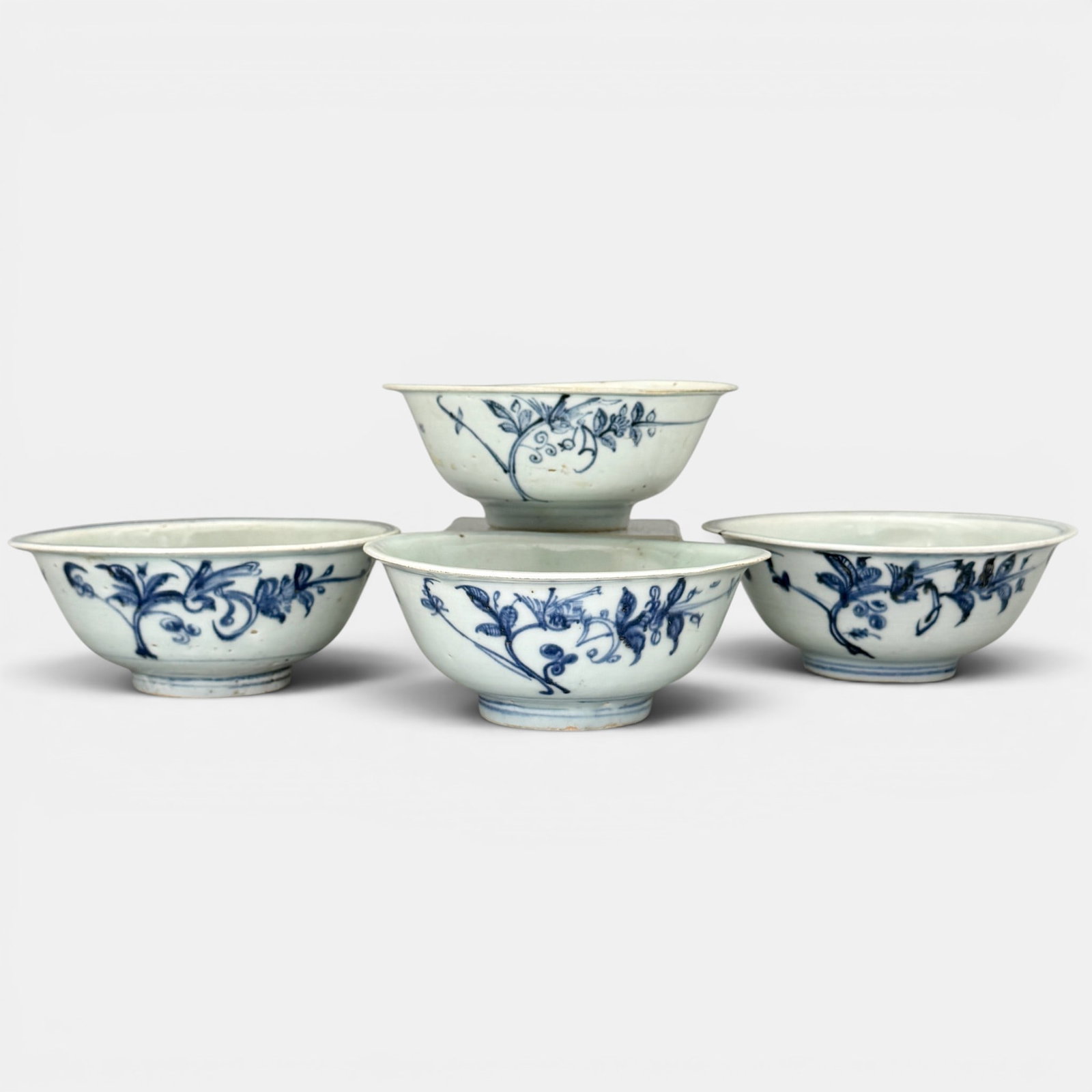 Four Ming Blue and White Dishes: All Ming, all decorated in underglaze blue. One with 7 panels to interior rim with fruit decoration and horse decoration to interior. Another with crane and two dishes decorated with floral design. La