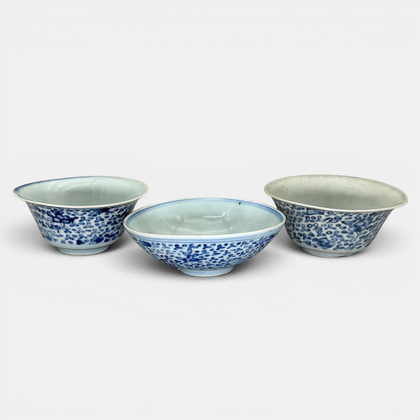 Three Ming Blue and White Bowls: Three bowls, each with flowering pattern and interior decoration. Ht, of tallest 2.5".