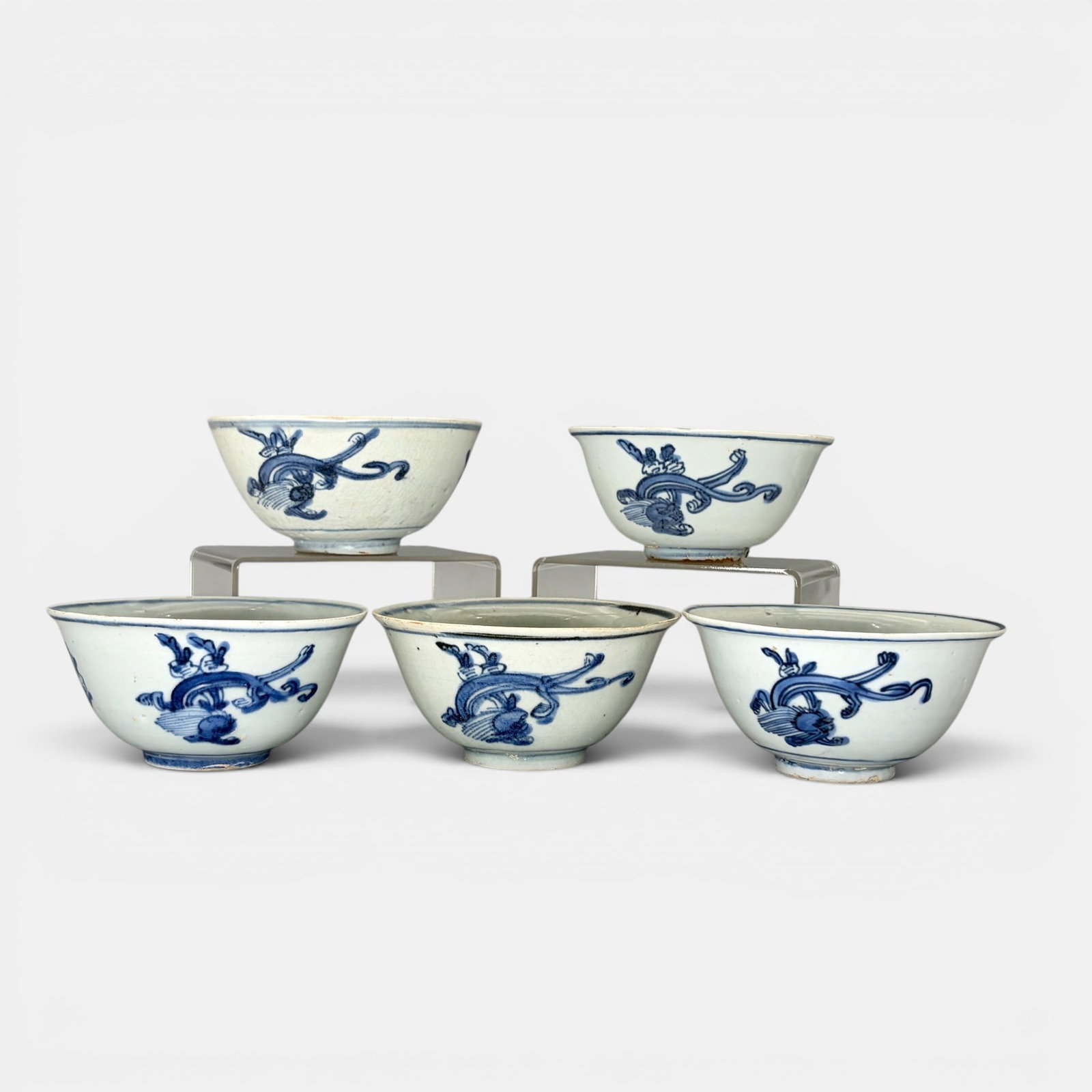 Five Ming Bowls with Beast Decoration: All Ming bowls, with similar beast design to body, one with a shop mark. Tallest 2.5", diameter 5".