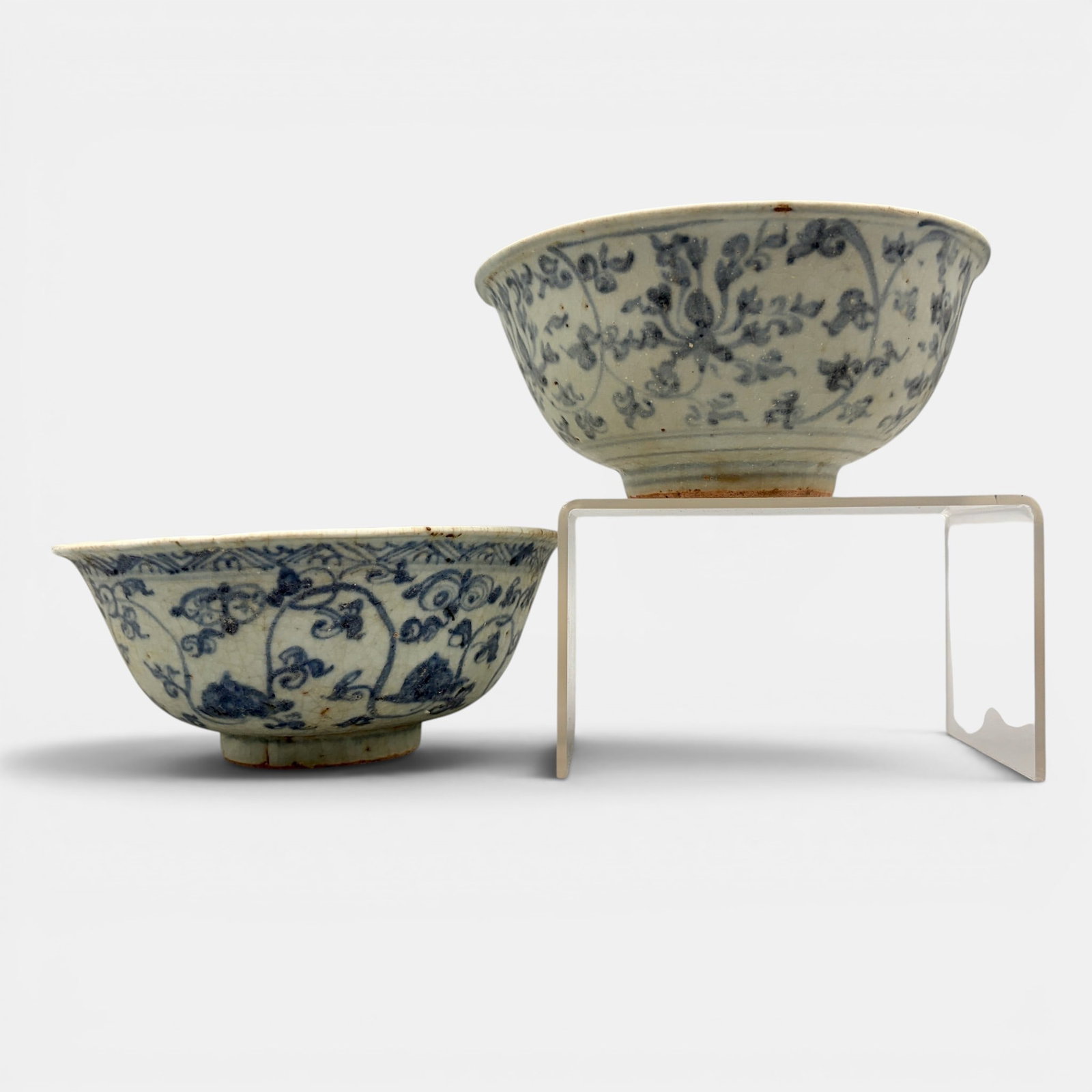 Pair of Ming Blue and White Bowls: Each early Ming, with underglaze blue flowers and foliage to body and interior. Each ht. 2.75", diameter 6.25".