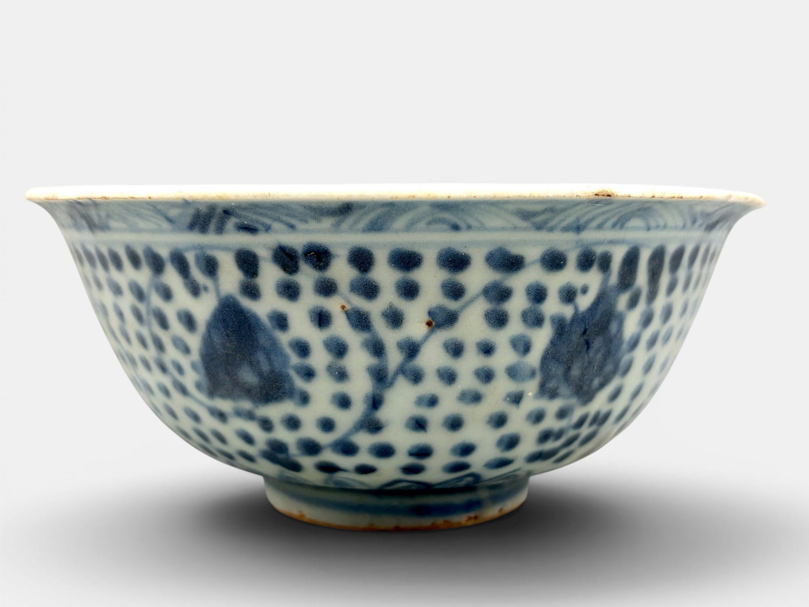 Ming Blue and White Bowl with Repeating Pattern: Ming dynasty, decorated in underglaze blue. Nice repeating pattern decoration, with lotus leaf pattern to upper foot, floral interior. Diameter: 5.75"