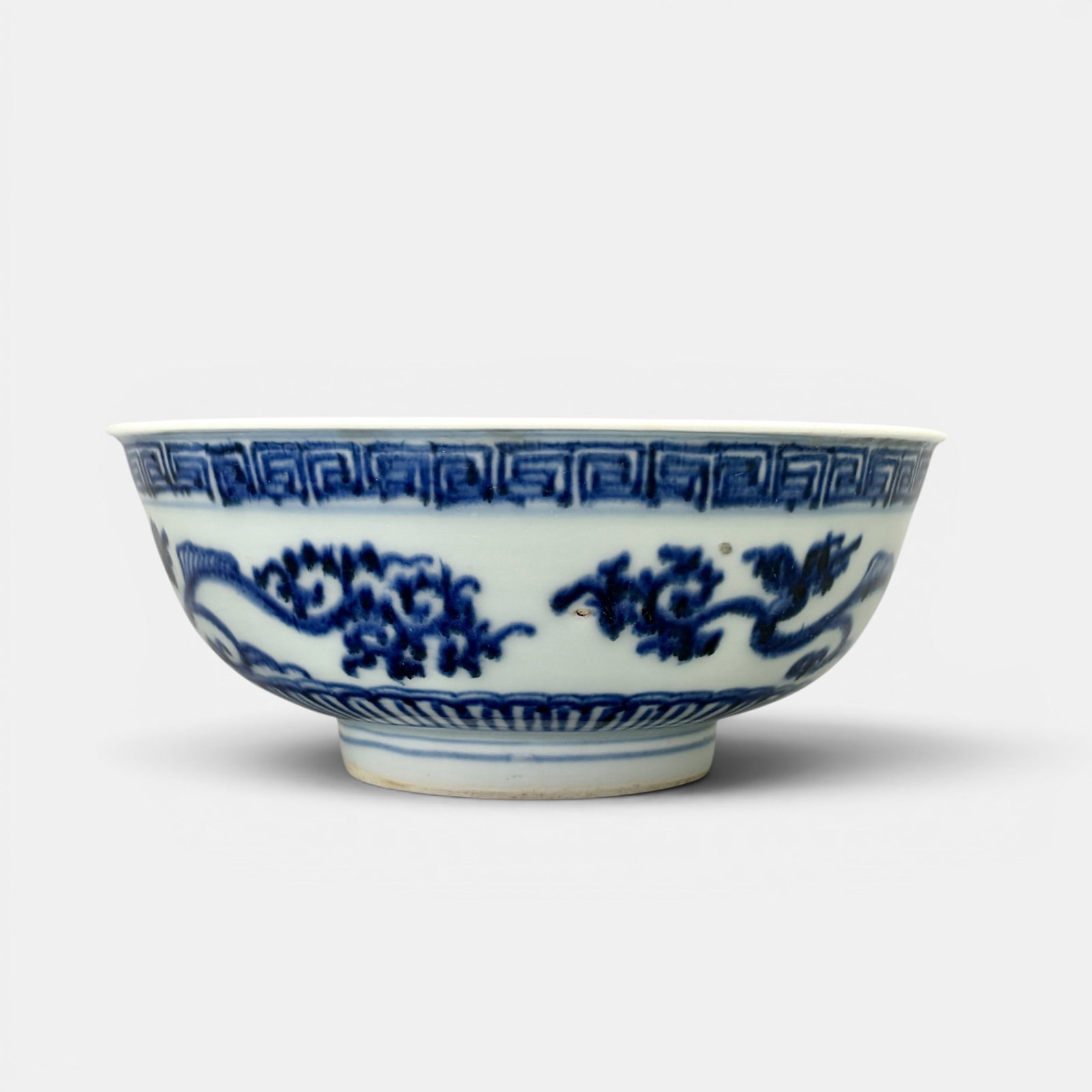 Ming Blue and White Bowl: Shop mark to underside, late Ming, crisp decoration of branchine, foot and rim with patterned underglaze blue. Ht. 3", diameter 6.75".