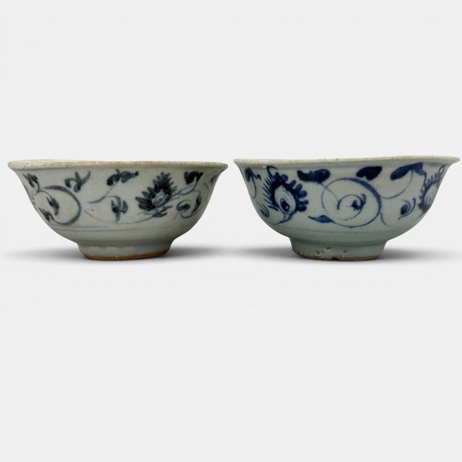 Pair of Ming Blue and White Bowls: A pair of blue underglaze bowls, early Ming. One with more pronounced cobalt tone, but each with similar decoration. Ht. of each 2.75", diameter 6".