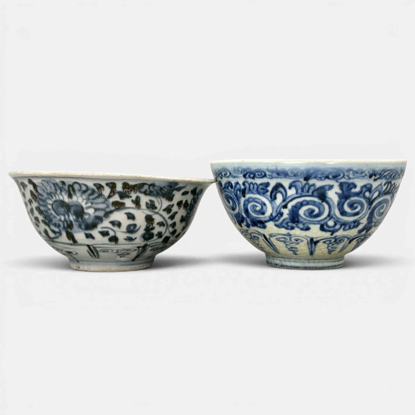 Pair of Ming Blue and White Bowls: Each with similar decoration to body, although one in more muted, darker cobalt tone. Ht. of each 3", diameters 6".